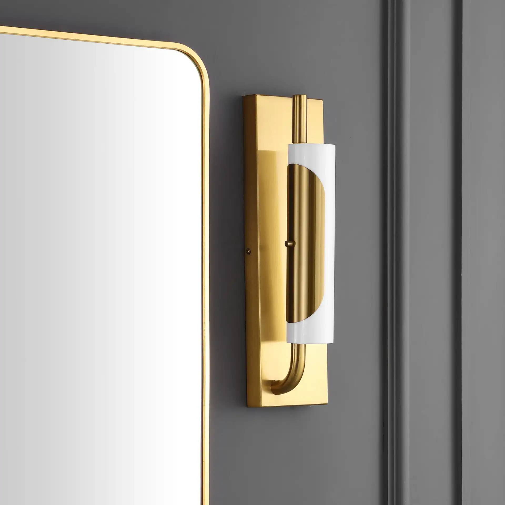 Momo Led Wall Sconce in Brass in a styled room