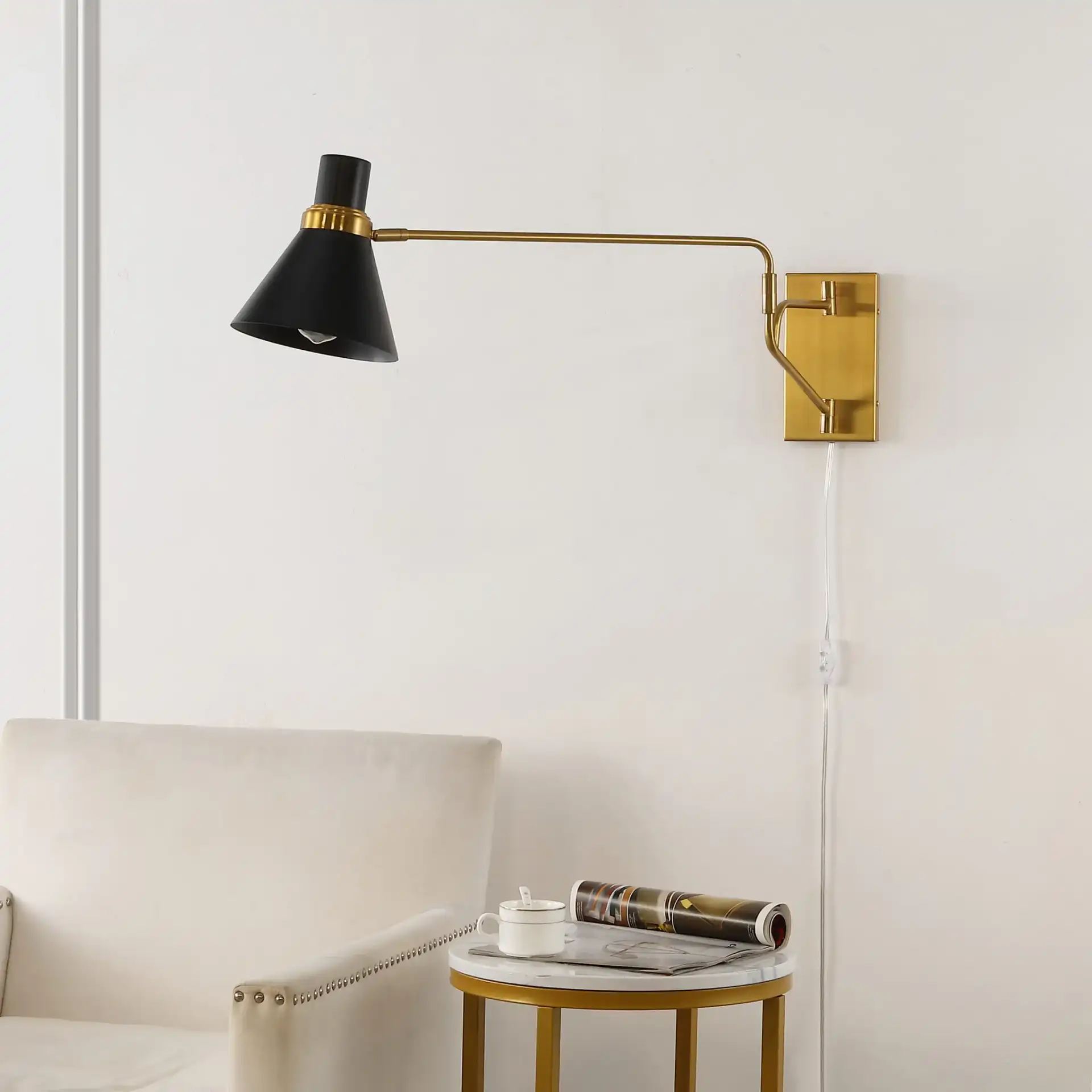 Cleome Wall Sconce in Brass / Black in a styled room