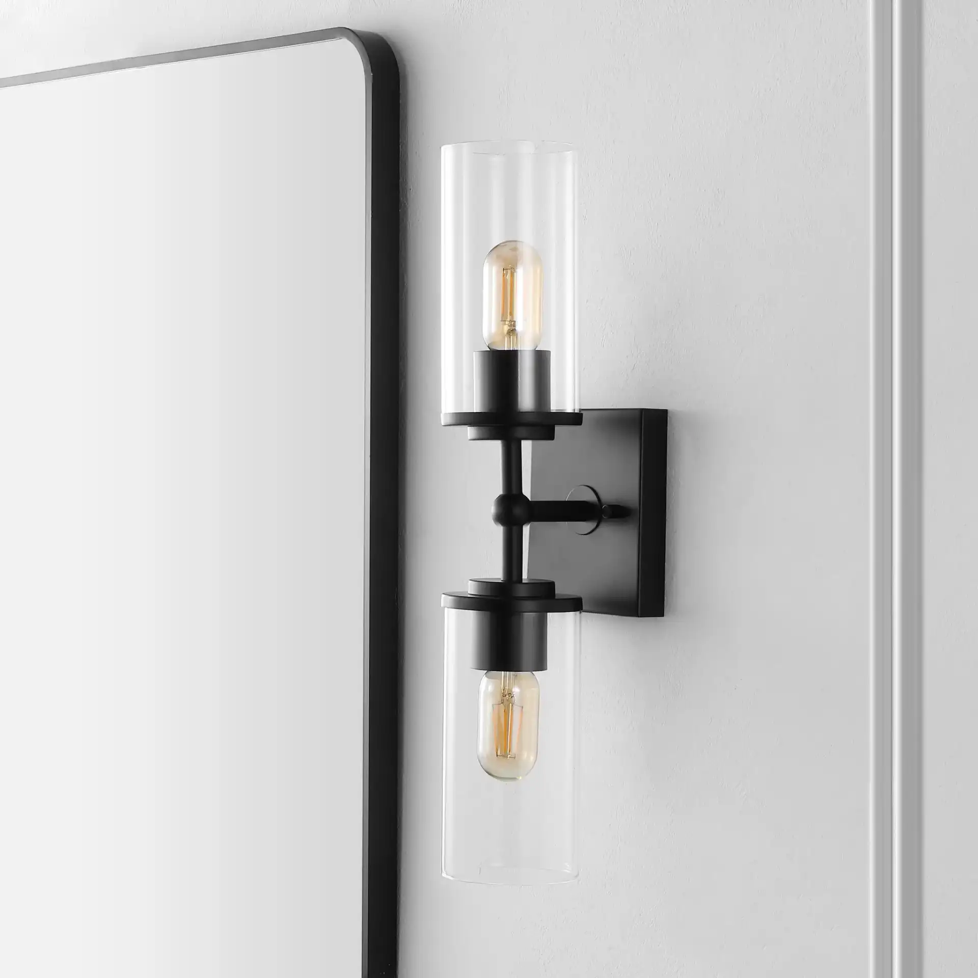 Lolita Two-Light 6" Wall Sconce in Black in a styled room