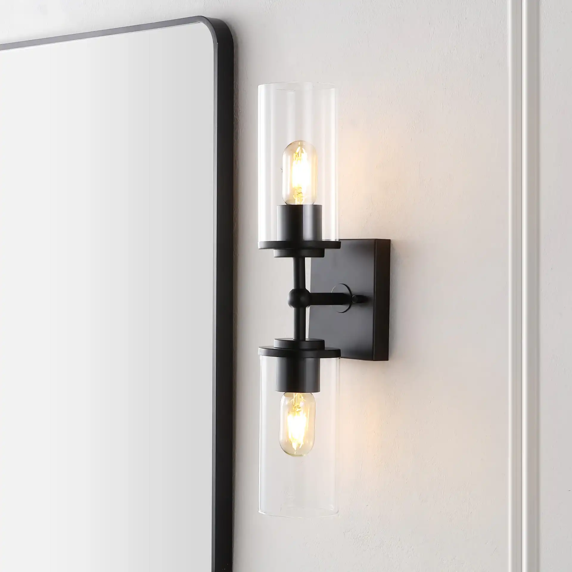 Lolita Two-Light 6" Wall Sconce in Black in a styled room
