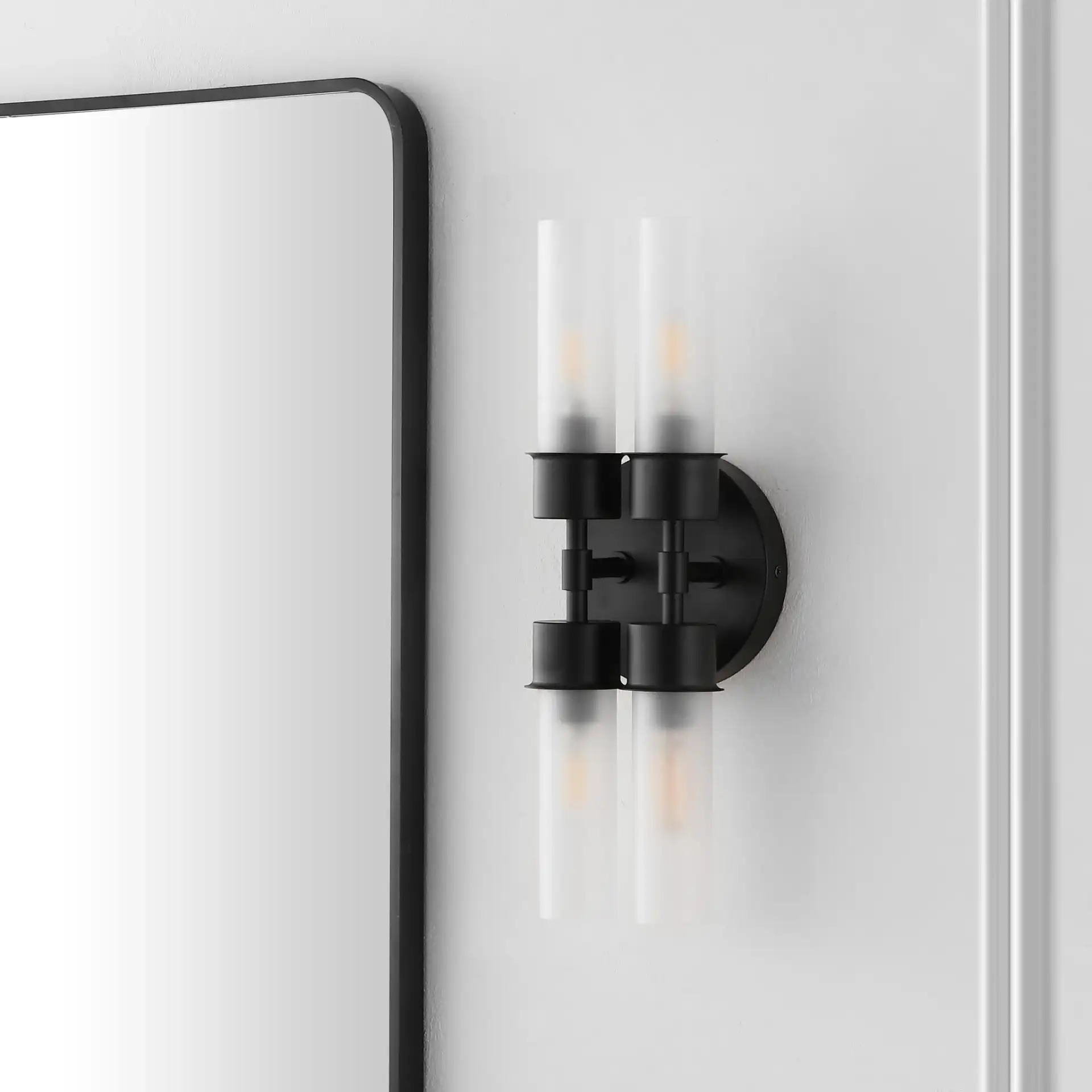 Joli Four-Light Wall Sconce in Black in a styled room
