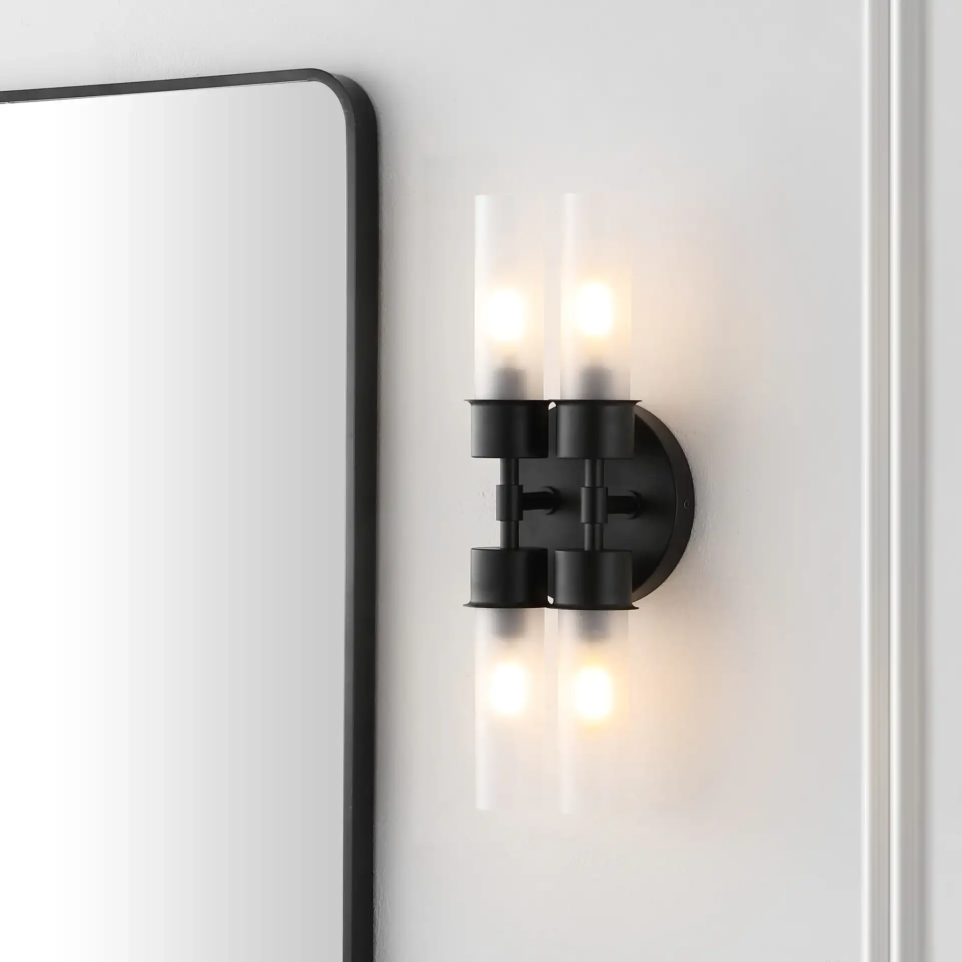 Joli Four-Light Wall Sconce in Black in a styled room