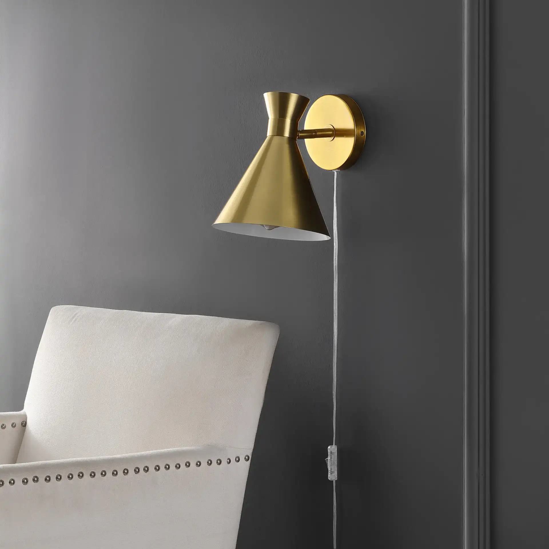 Jordie Wall Sconce in Brass in a styled room