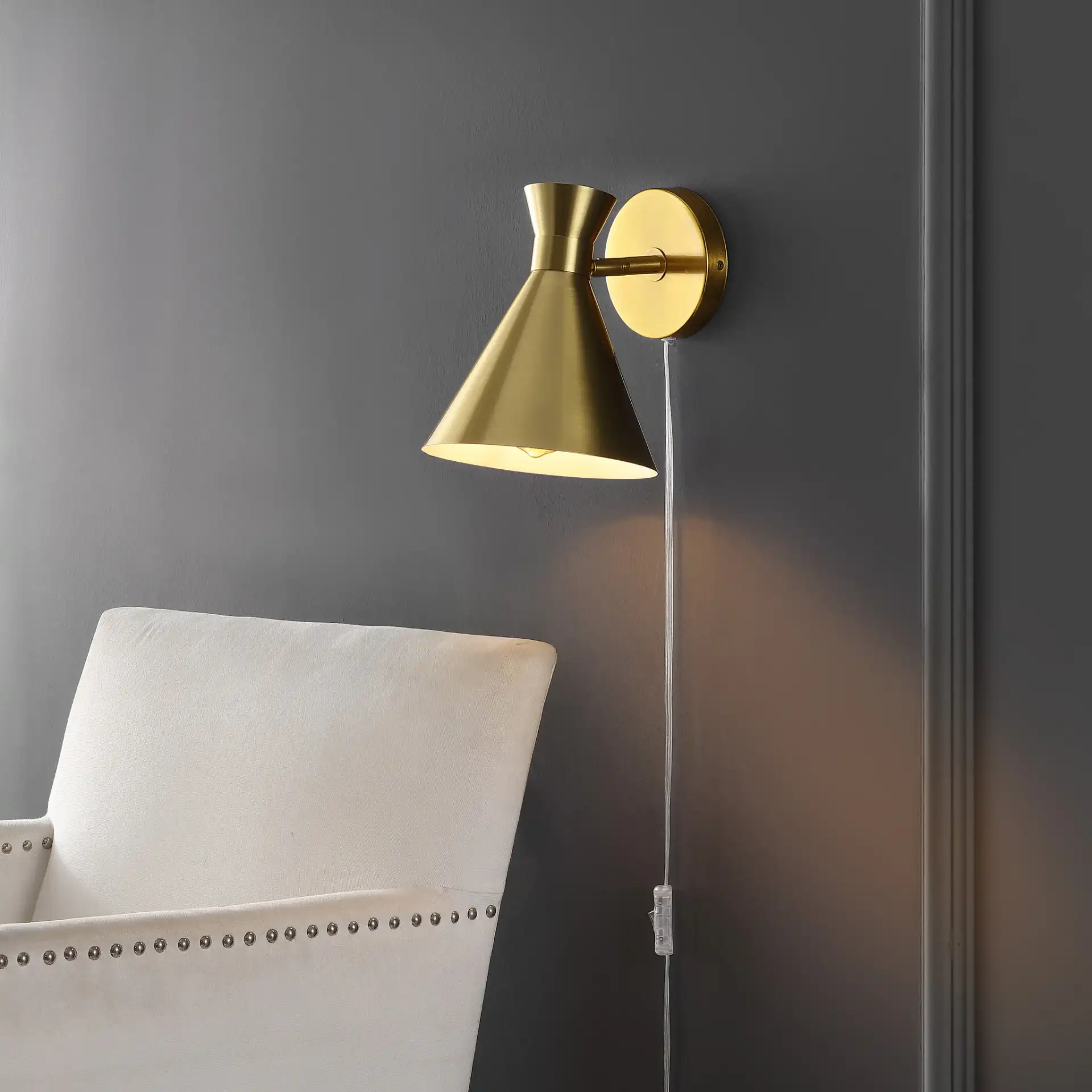 Jordie Wall Sconce in Brass in a styled room