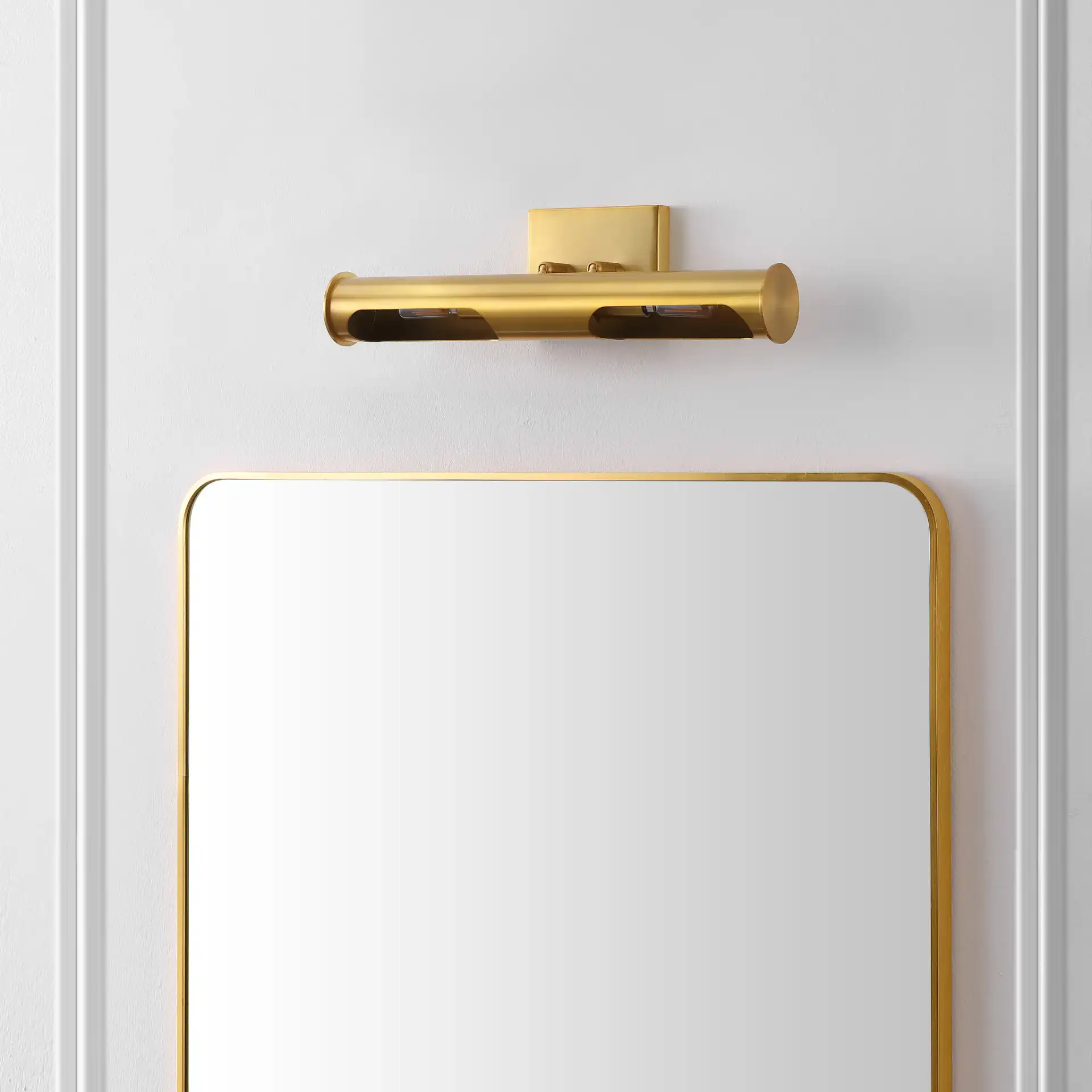 Robyn Two-Light Wall Sconce in Brass in a styled room