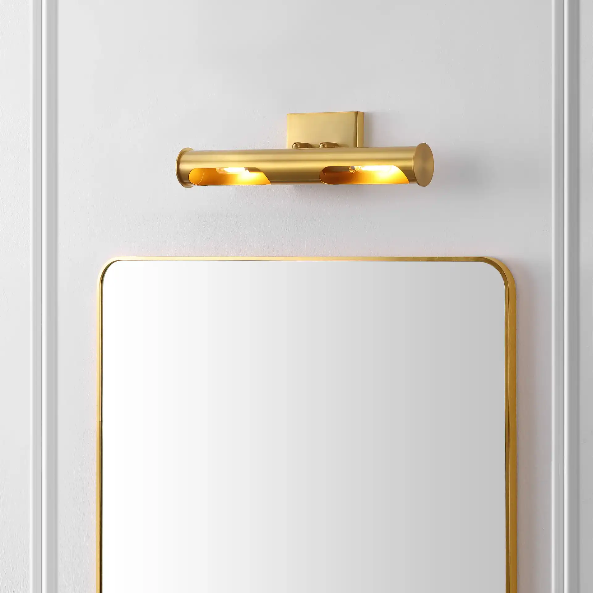 Robyn Two-Light Wall Sconce in Brass in a styled room