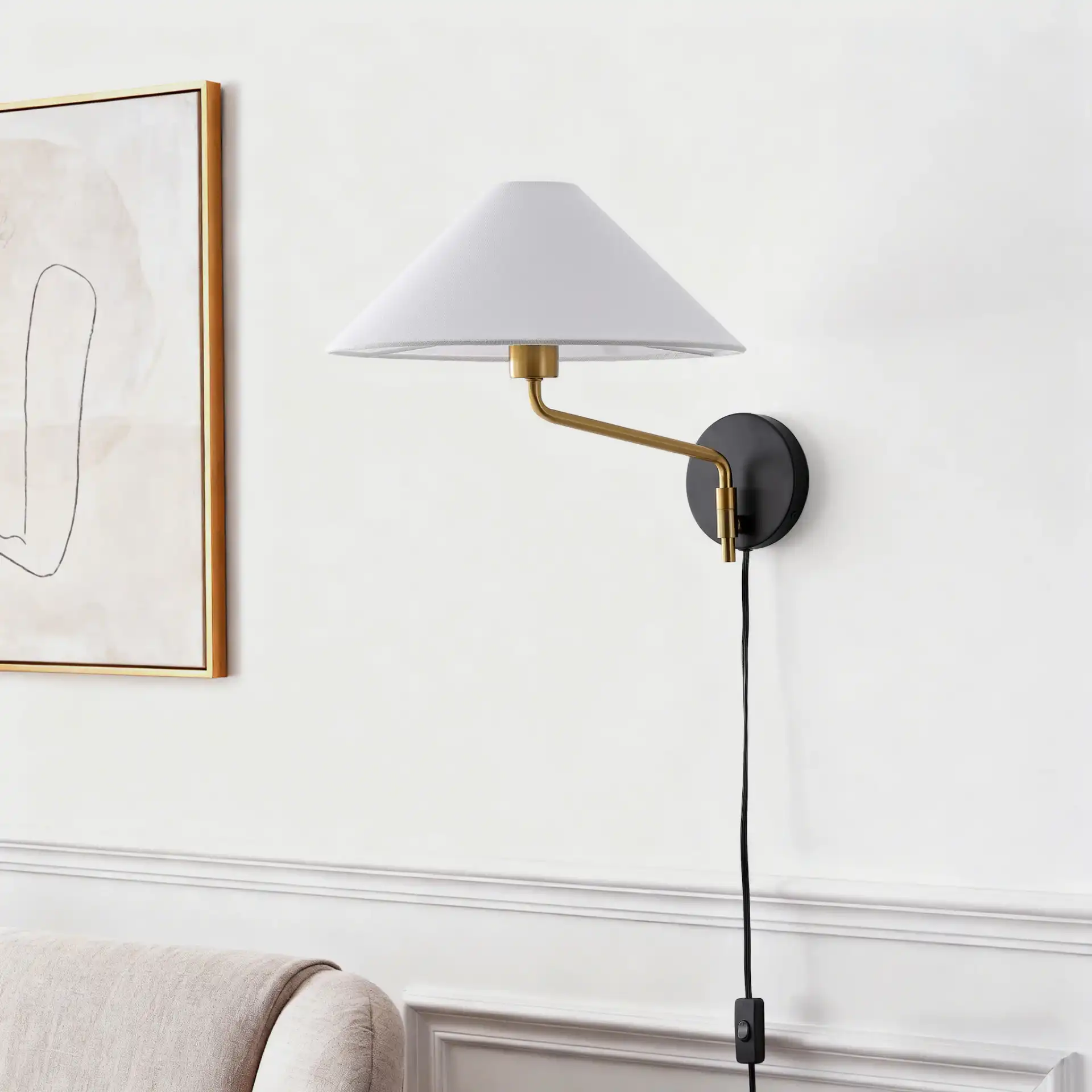 Marni Wall Sconce in Brass / Black in a styled room