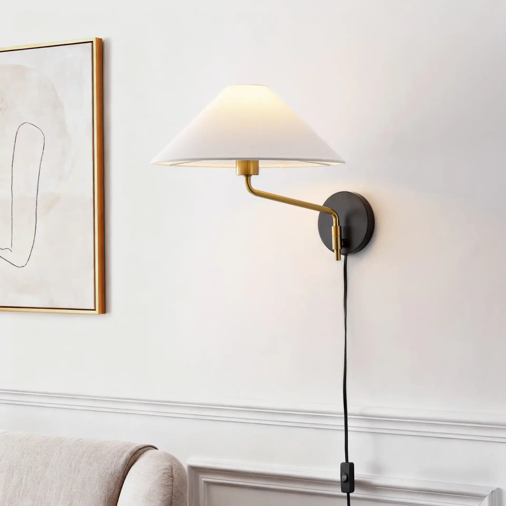 Marni Wall Sconce in Brass / Black in a styled room