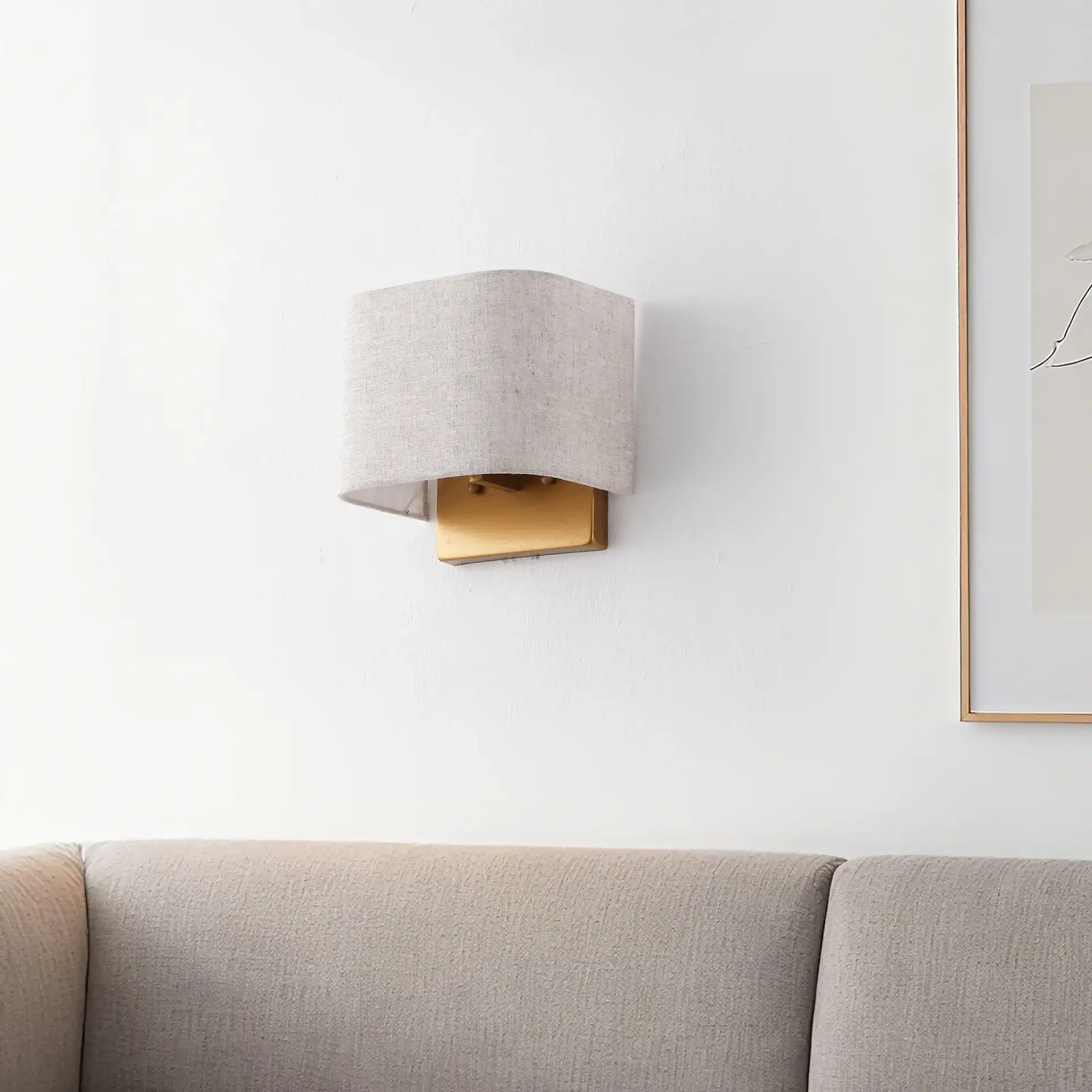 Deria Wall Sconce (Set Of 2) in Oatmeal / Gold in a styled room