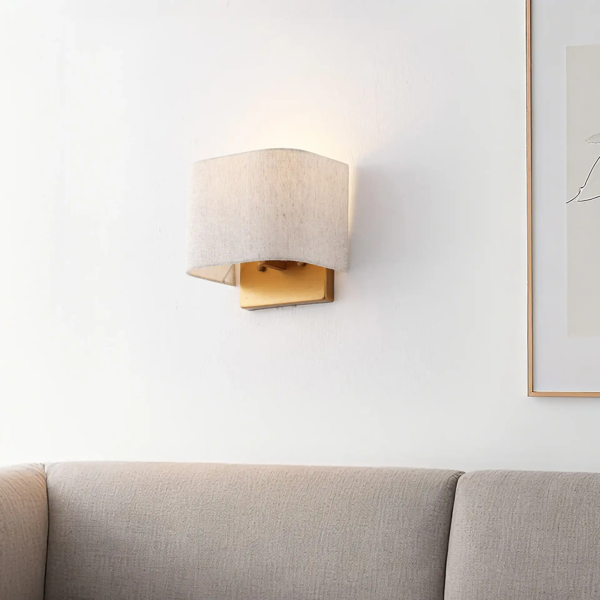 Deria Wall Sconce (Set Of 2) in Oatmeal / Gold in a styled room