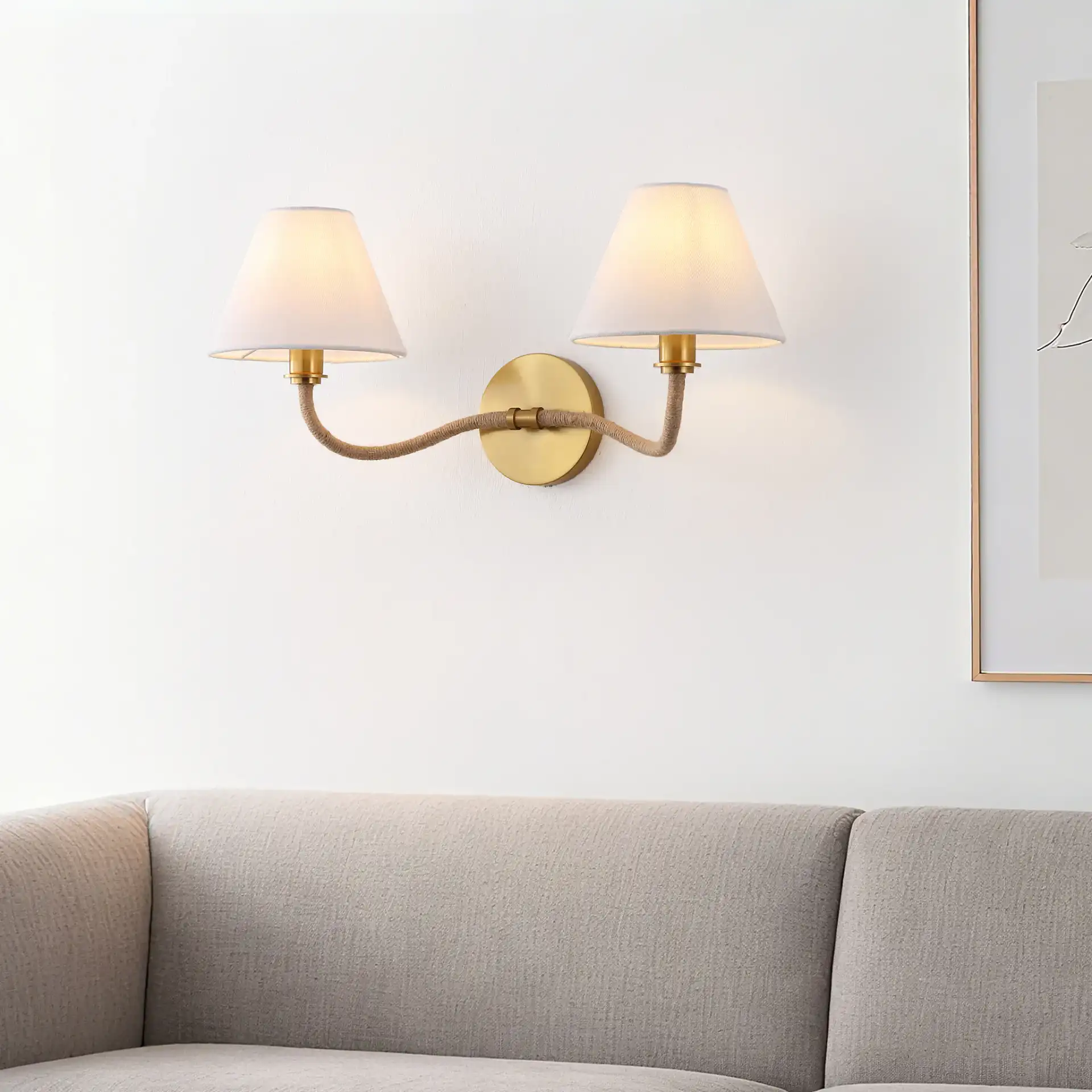 Mara Wall Sconce in Brass / White in a styled room