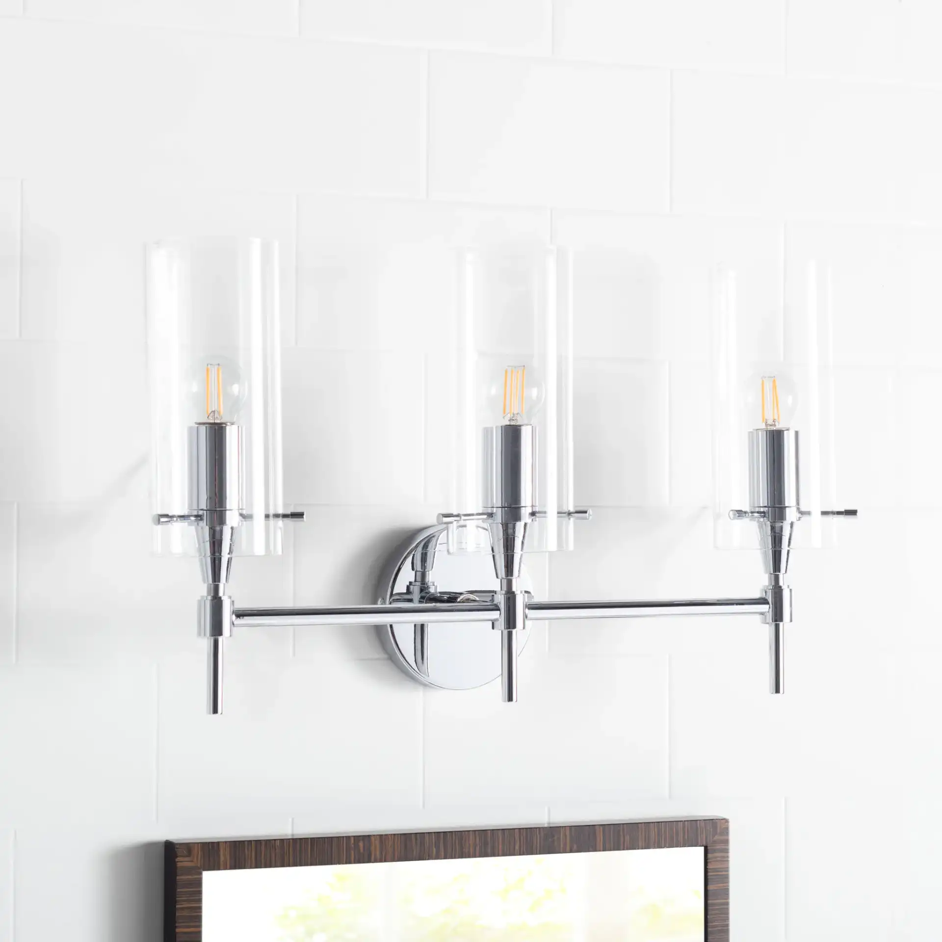 Norala Vanity Sconce in Black in a styled room