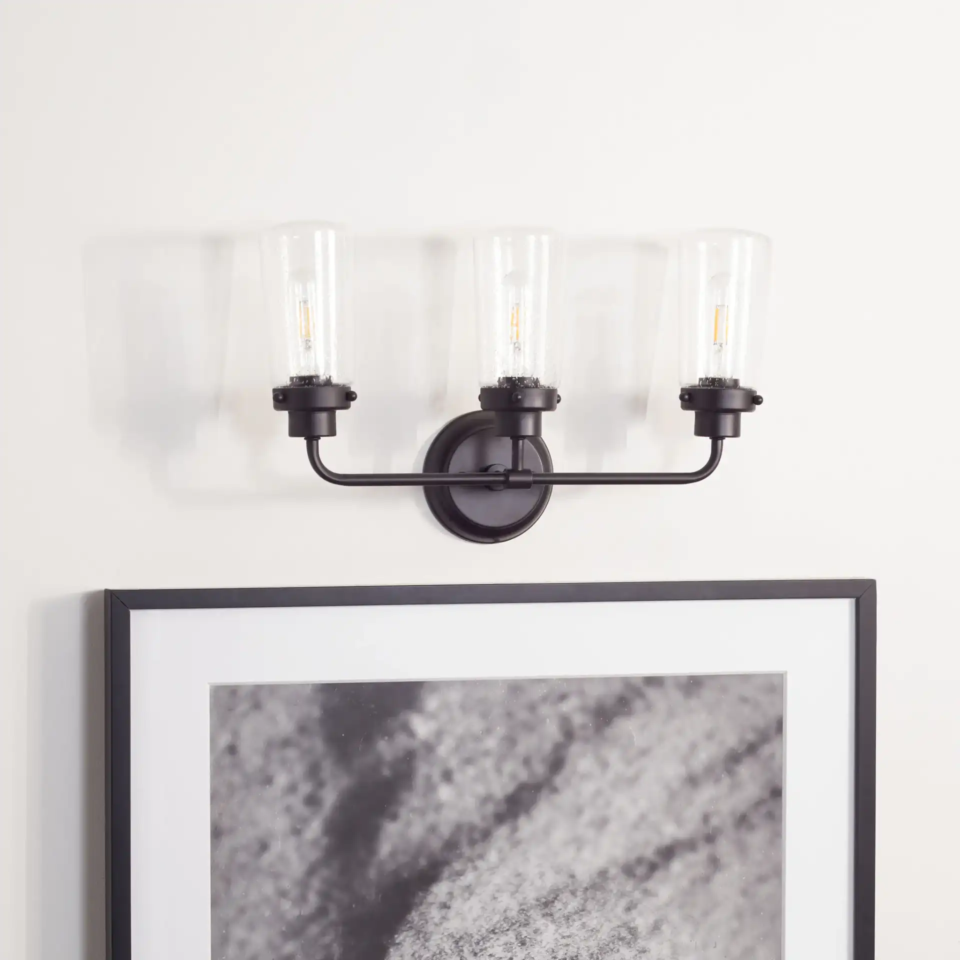 Derser Vanity Sconce in Oil Rubbed Bronze in a styled room