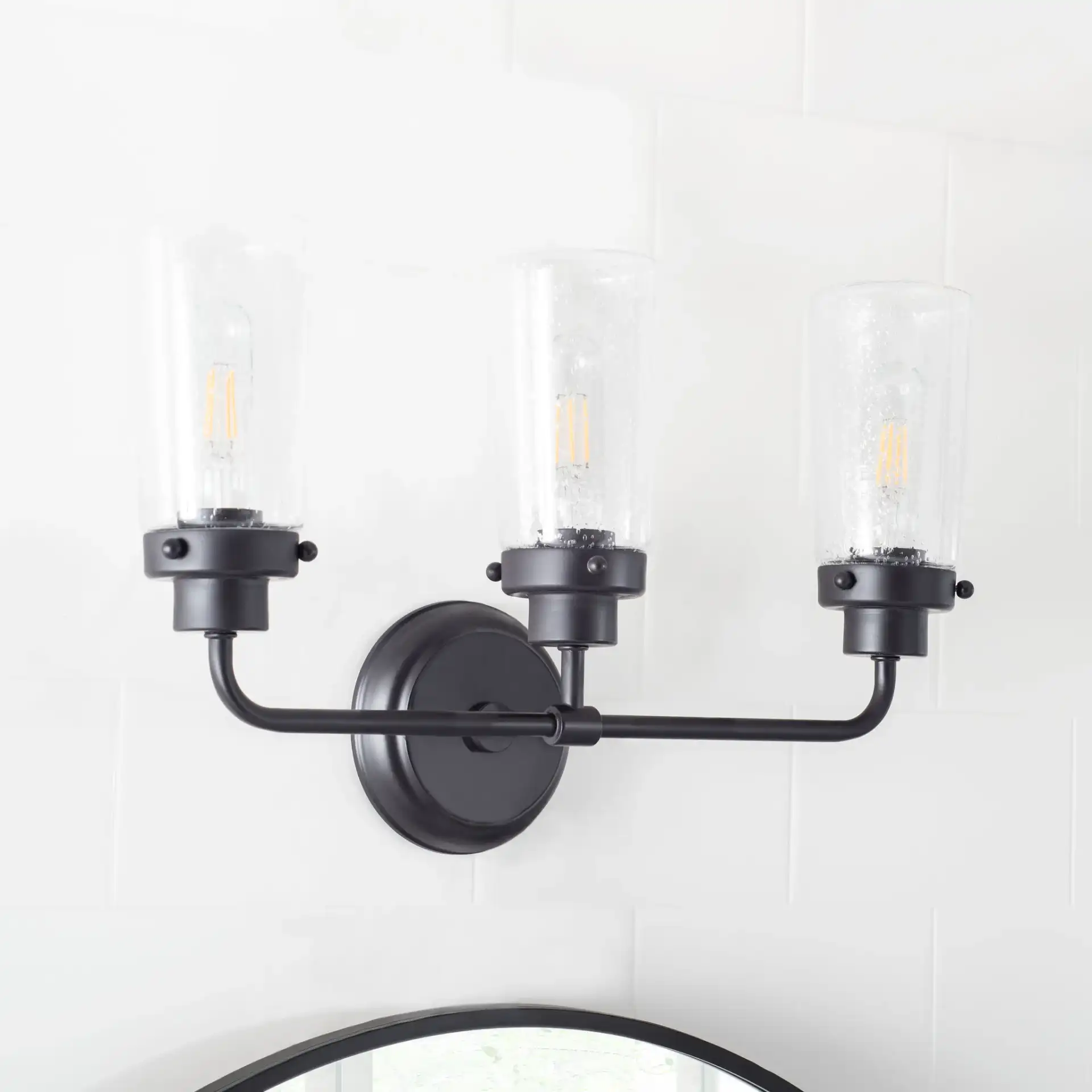 Derser Vanity Sconce in Oil Rubbed Bronze in a styled room