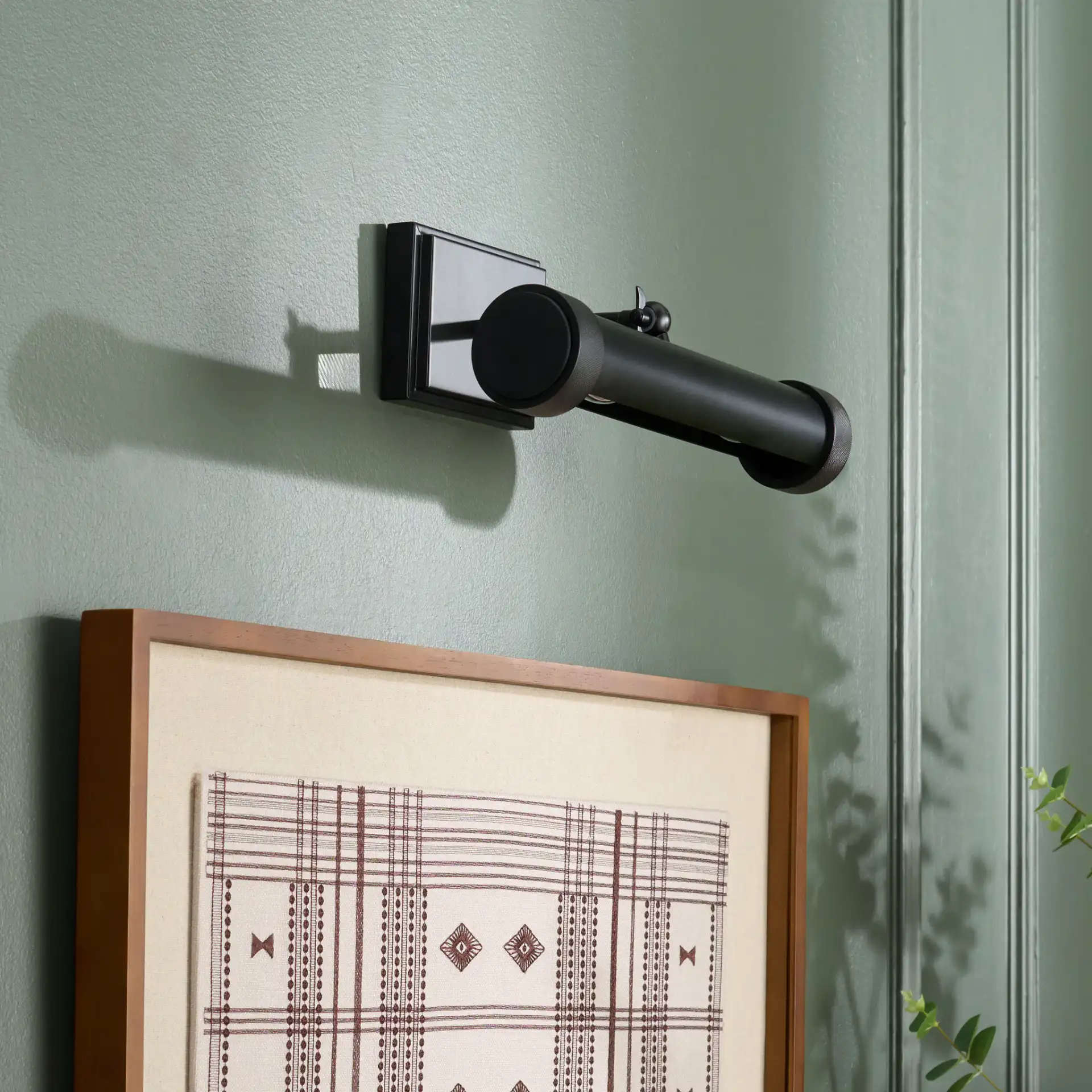 Andie Wall Sconce in Black in a styled room