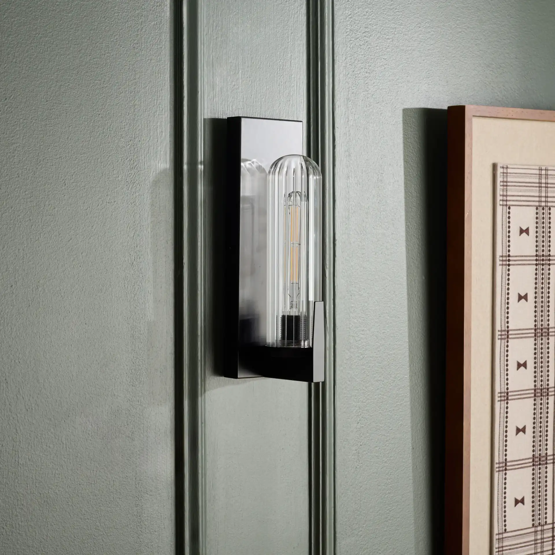 Nicola Wall Sconce (Set of 2) in Black in a styled room