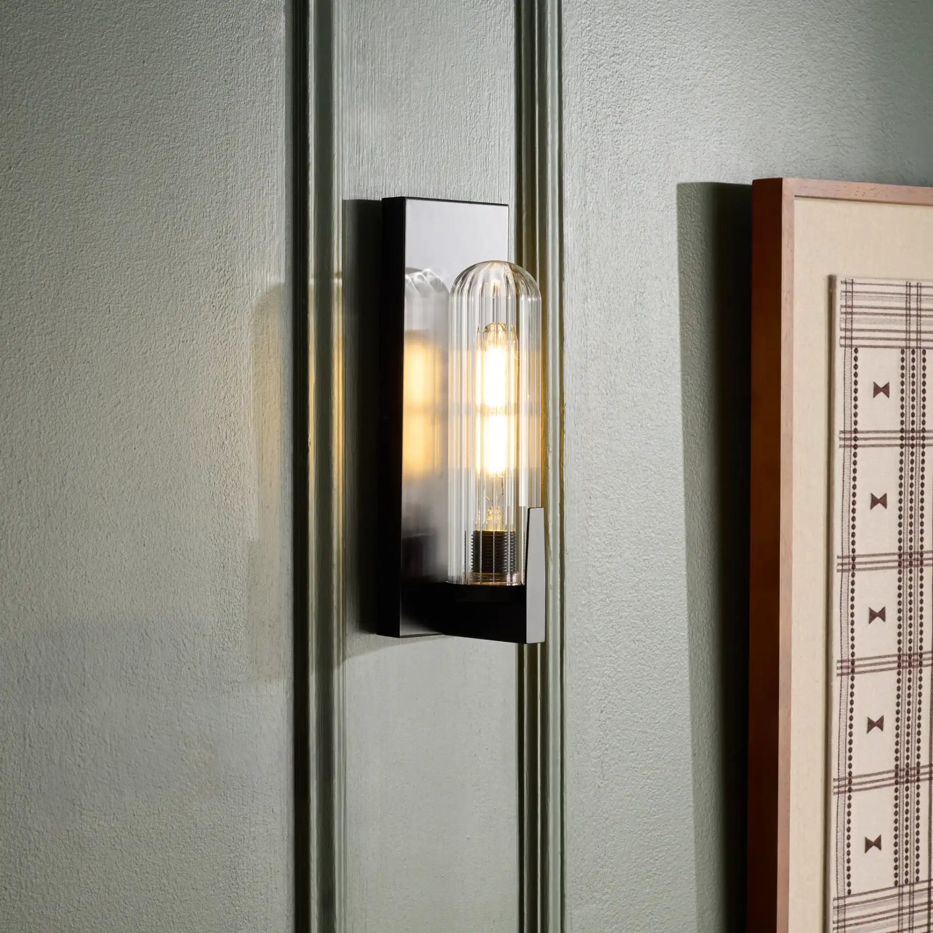 Nicola Wall Sconce (Set of 2) in Black in a styled room