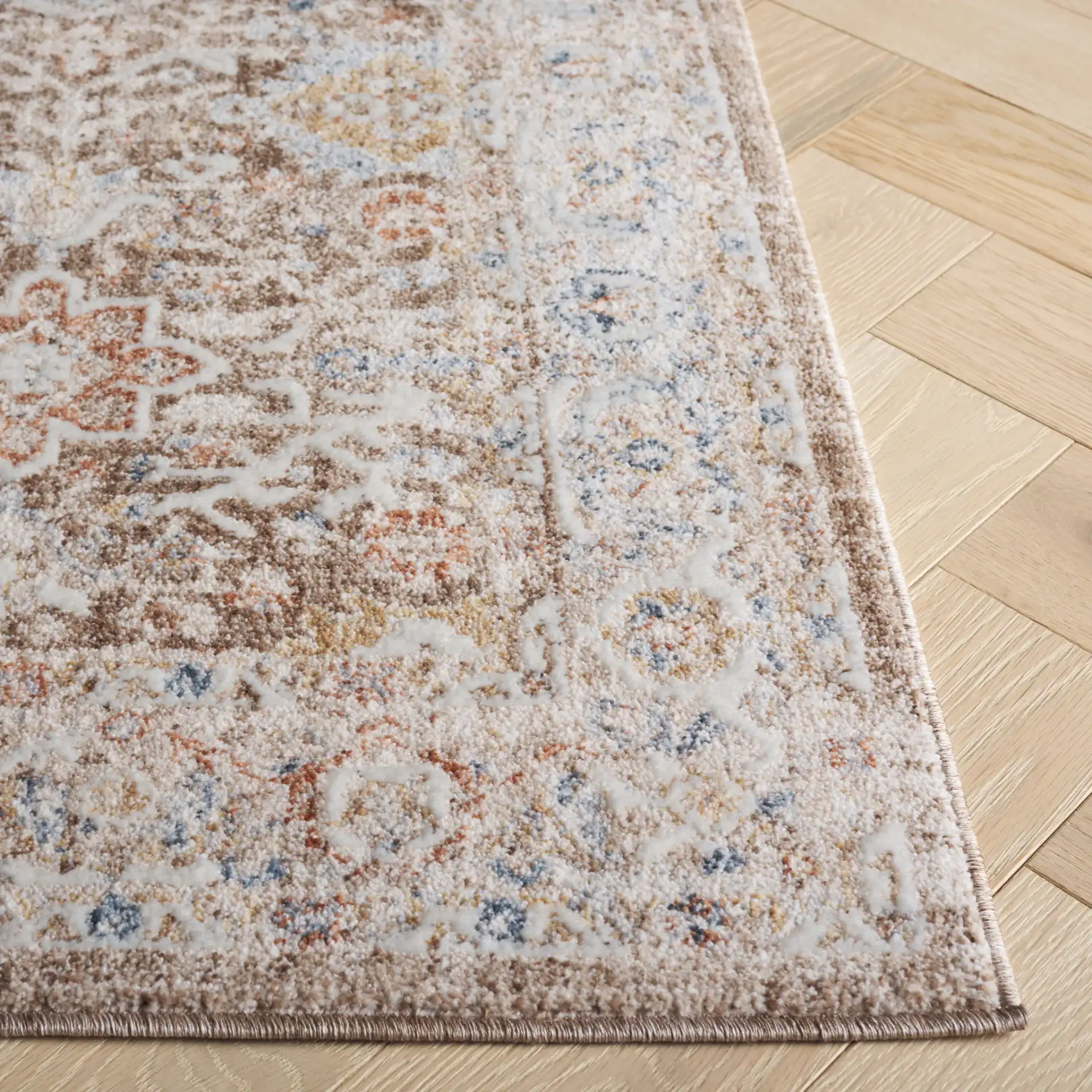 Scarlett Distressed Diamond Border Rug in Brown / Ivory in a styled room