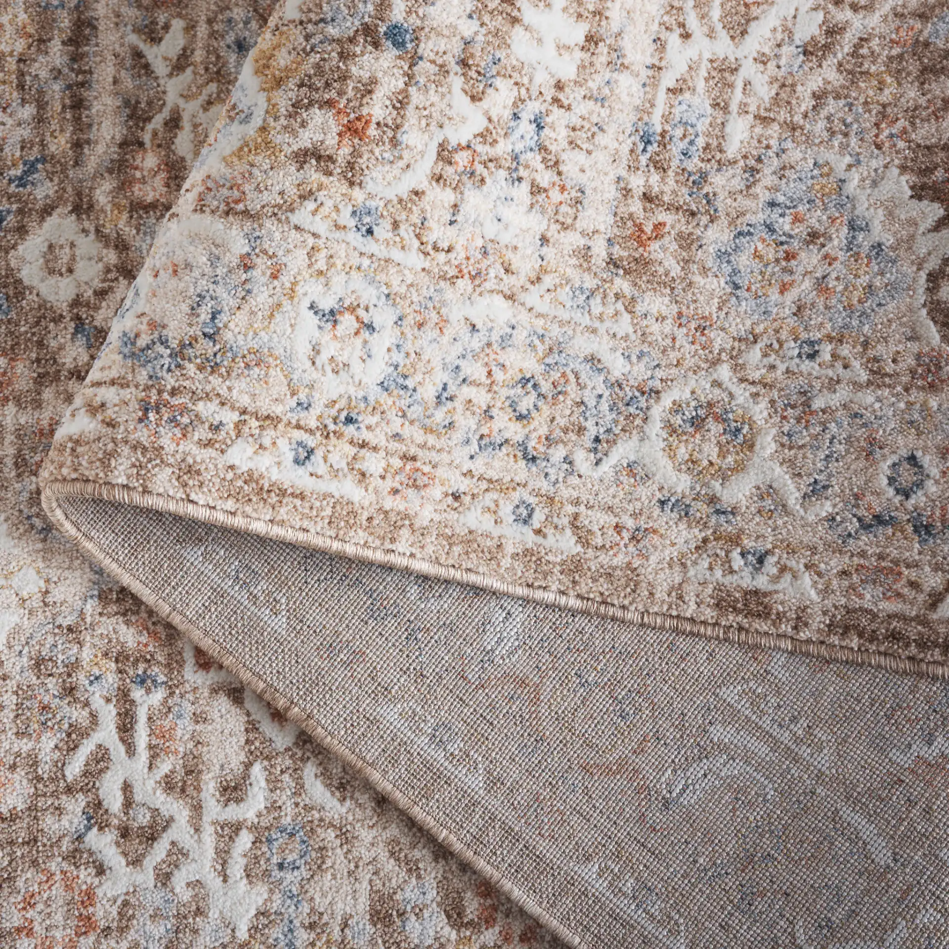 Scarlett Distressed Diamond Border Rug in Brown / Ivory in a styled room