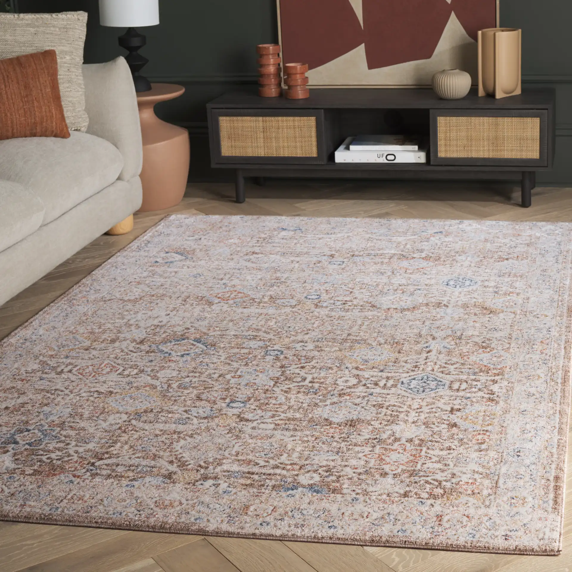 Scarlett Distressed Diamond Border Rug in Brown / Ivory in a styled room