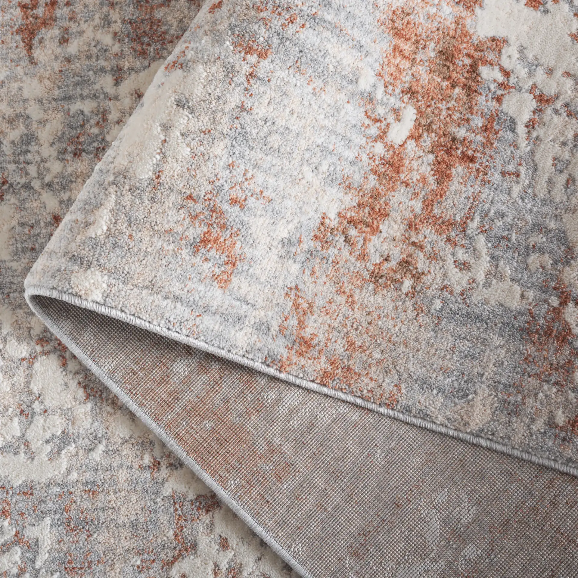 Scarlett Abstract Mottled Rug in Light Gray / Ivory Rust in a styled room