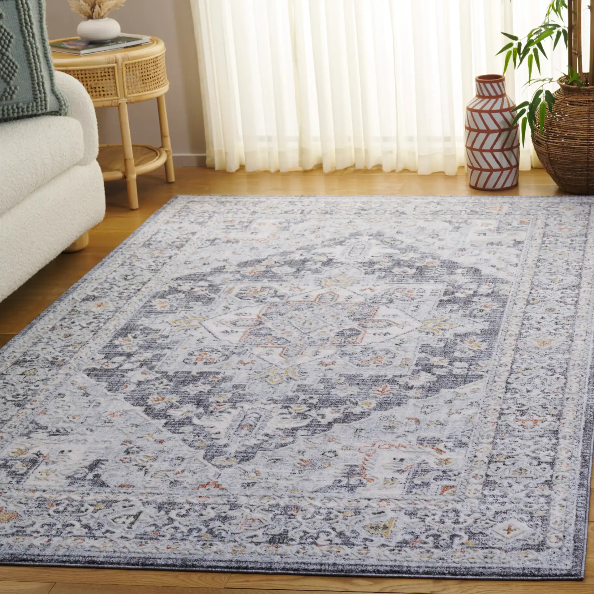 Scarlett Distressed Medallion Rug in Dark Gray / Ivory Rust in a styled room