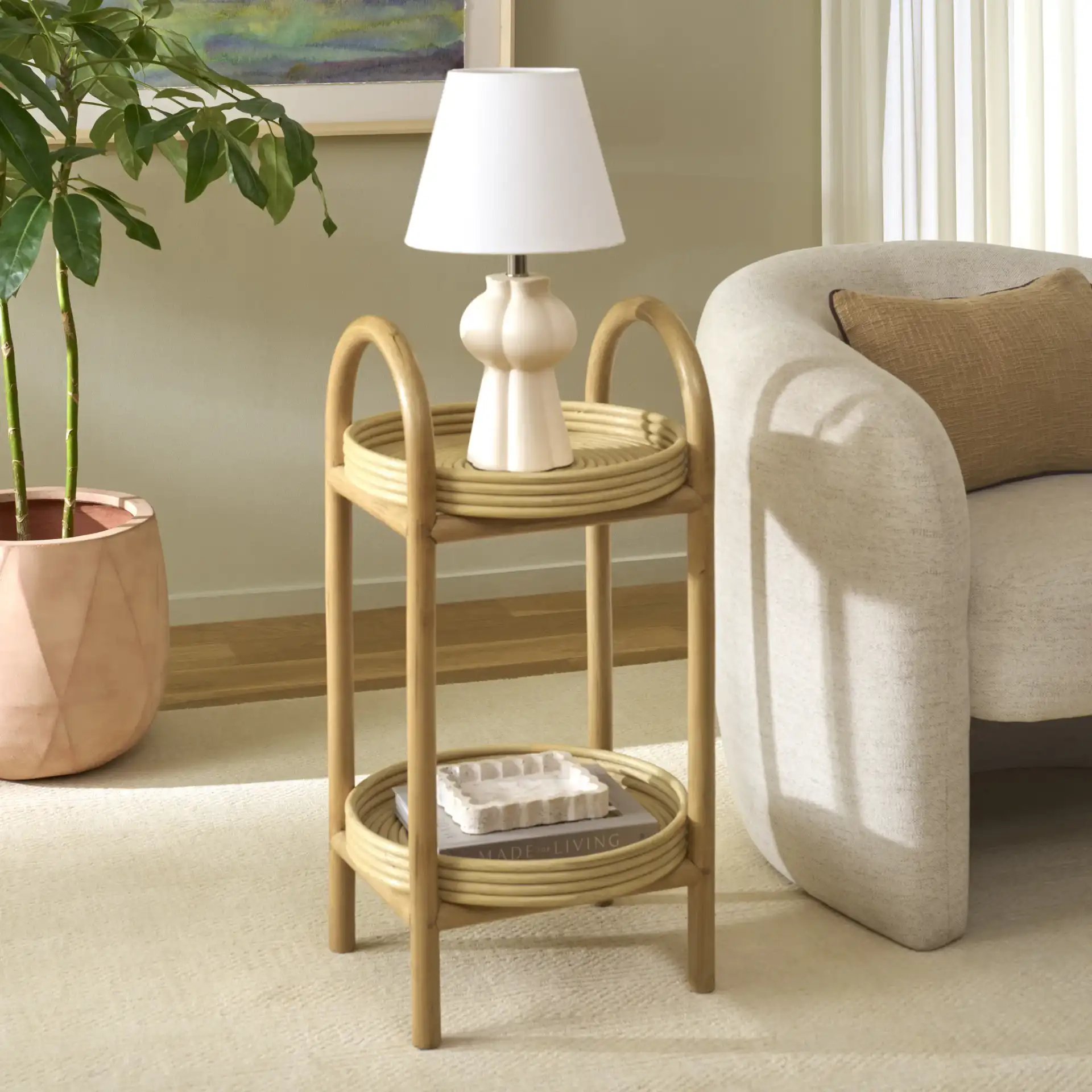 Lynda 2 Tiered Rattan Accent Table in Natural in a styled room