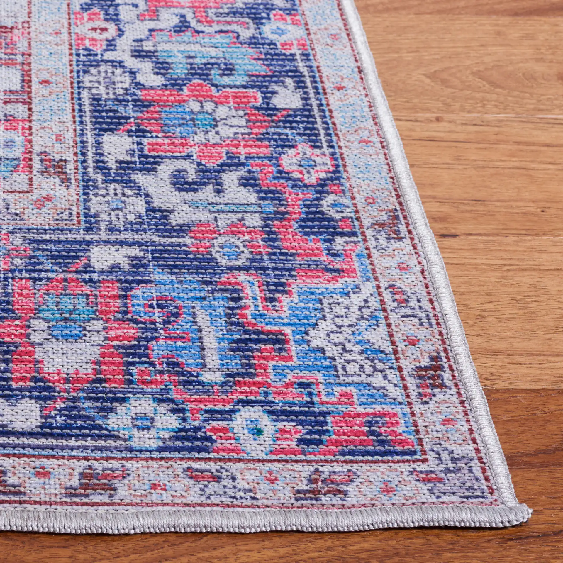 Serapi Stepped Medallion Washable Rug in Red / Navy in a styled room