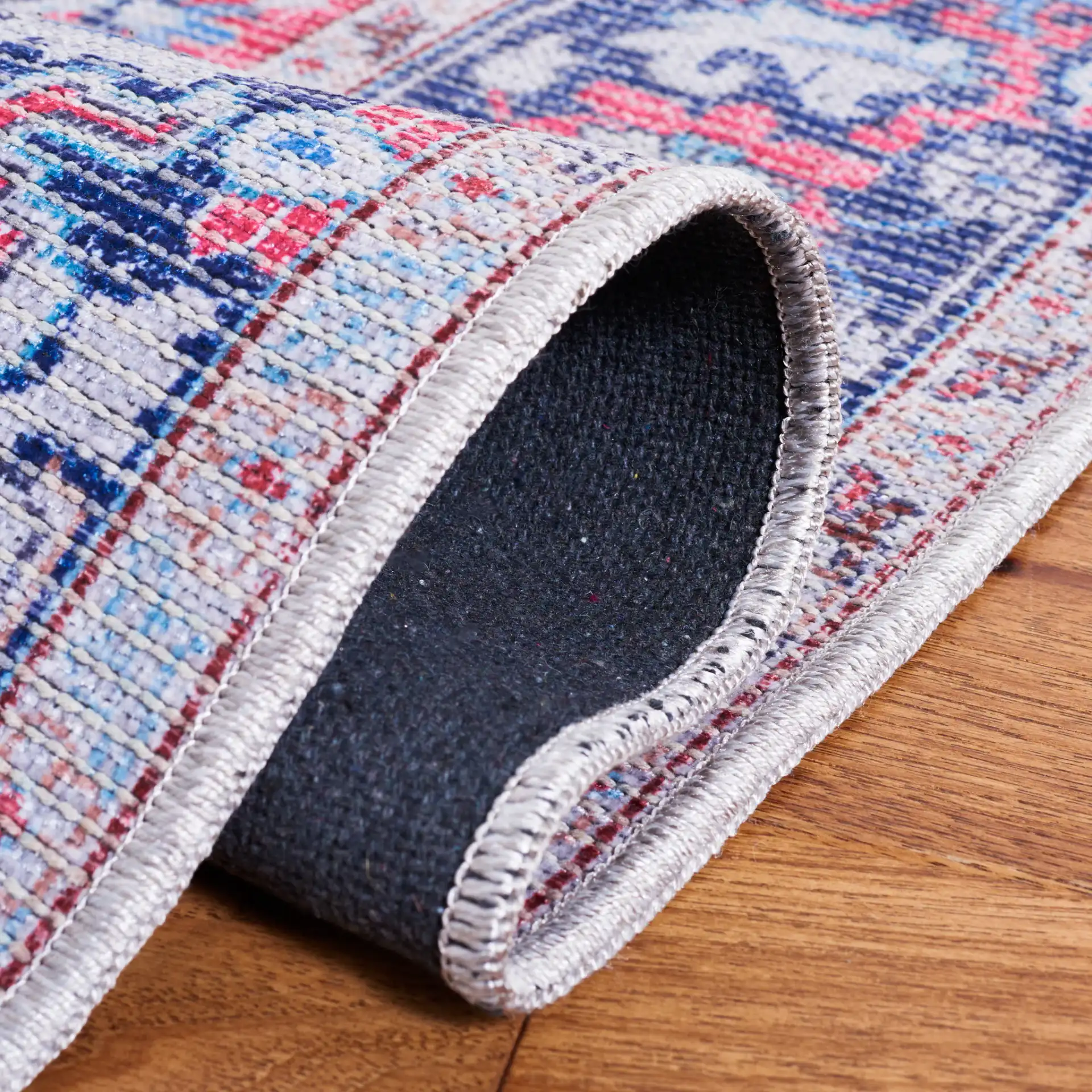 Serapi Stepped Medallion Washable Rug in Red / Navy in a styled room