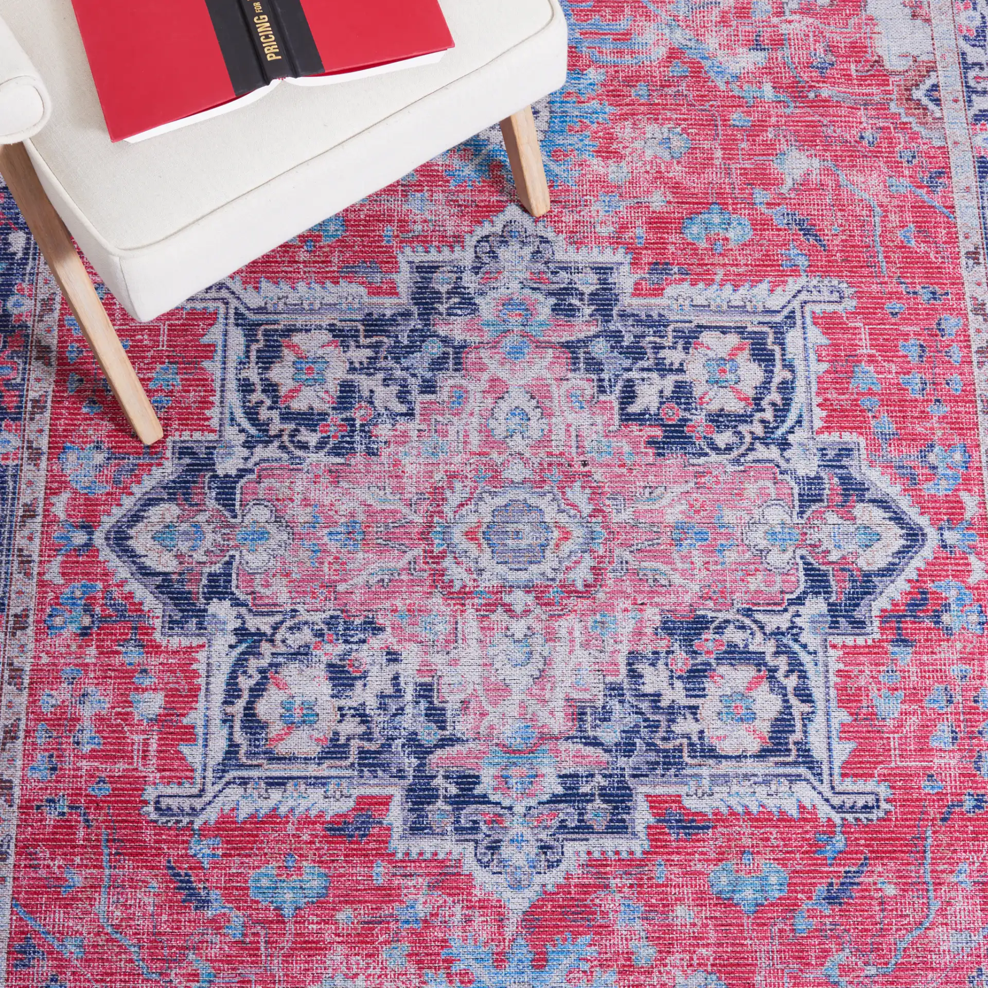 Serapi Stepped Medallion Washable Rug in Red / Navy in a styled room