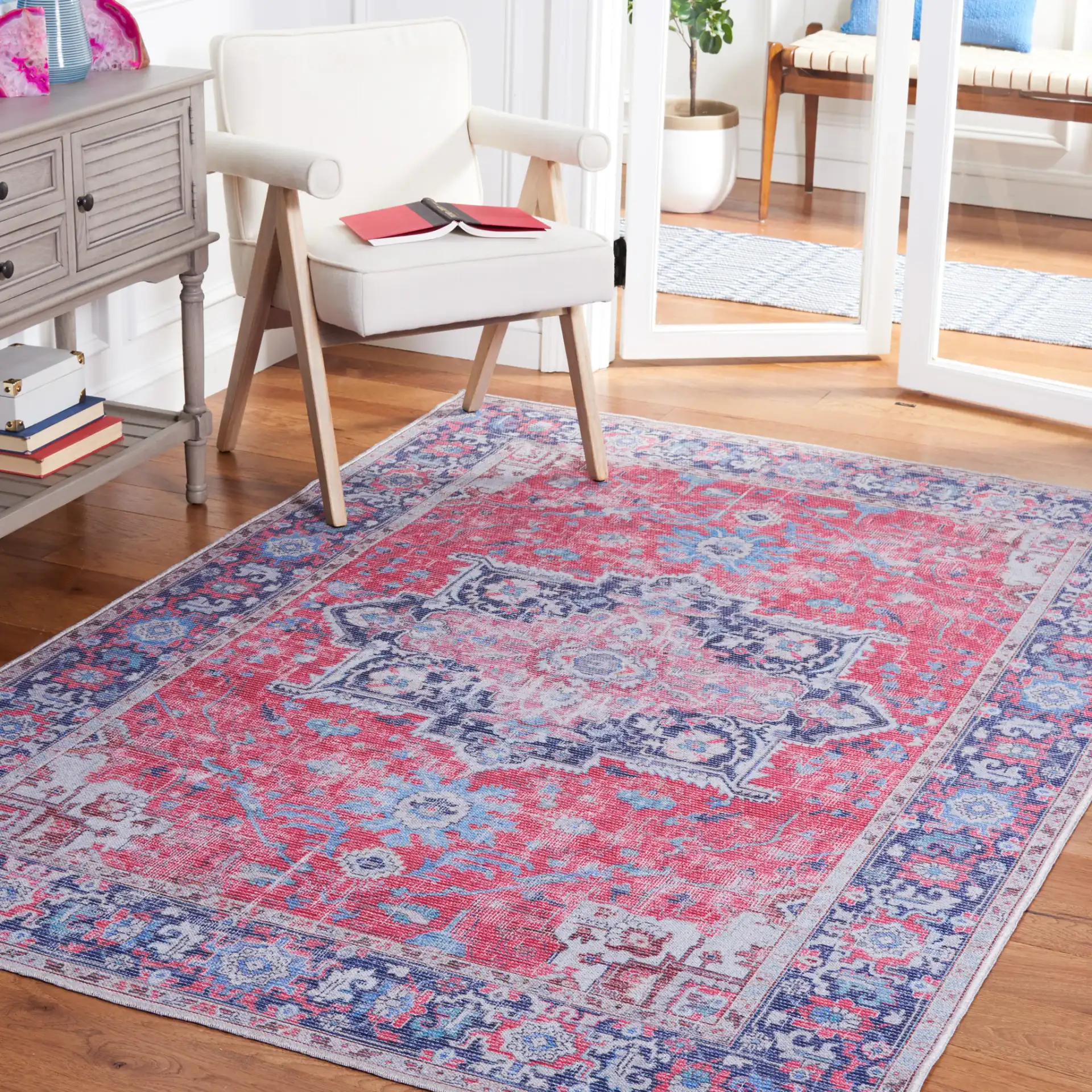 Serapi Stepped Medallion Washable Rug in Red / Navy in a styled room