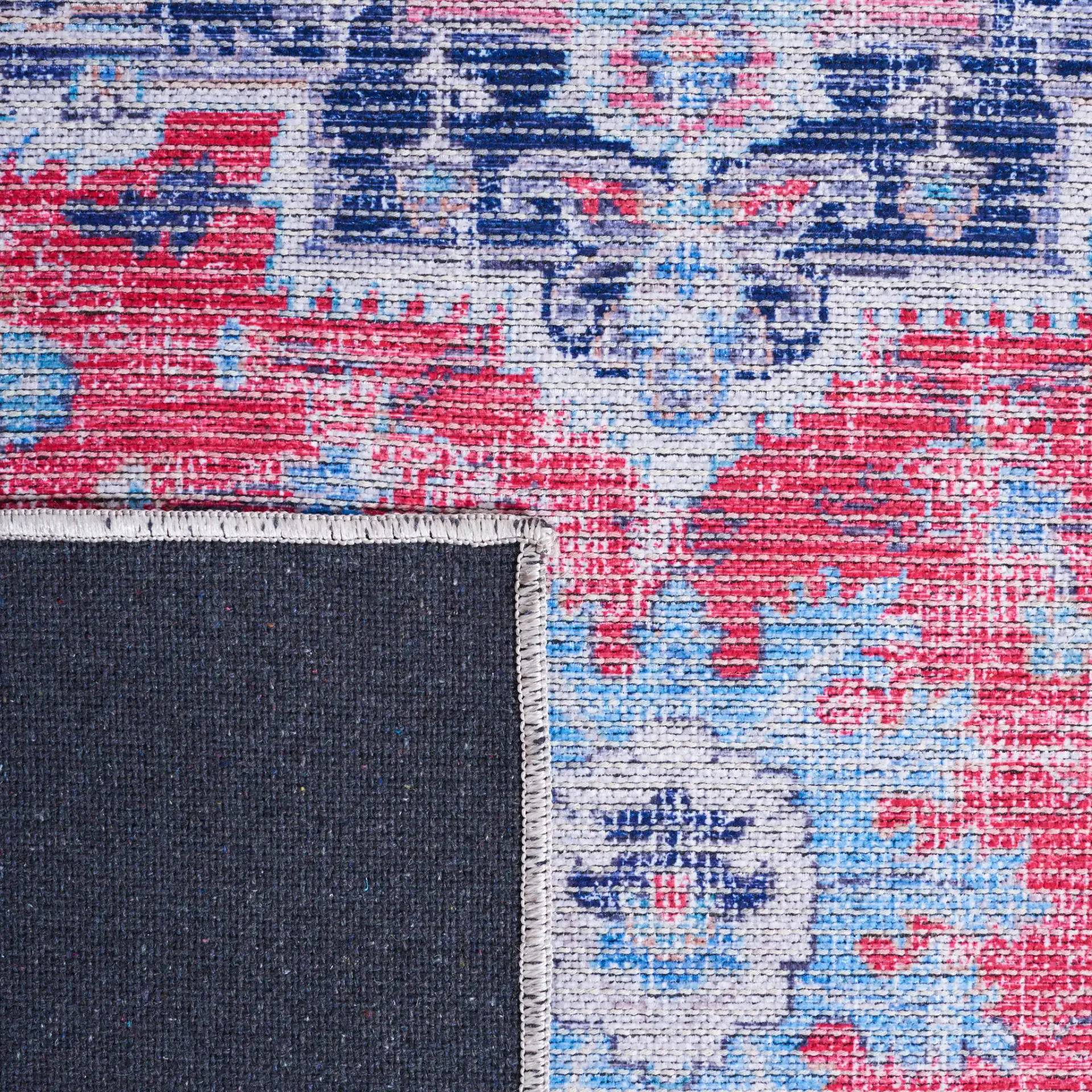 Serapi Stepped Medallion Washable Rug in Red / Navy in a styled room