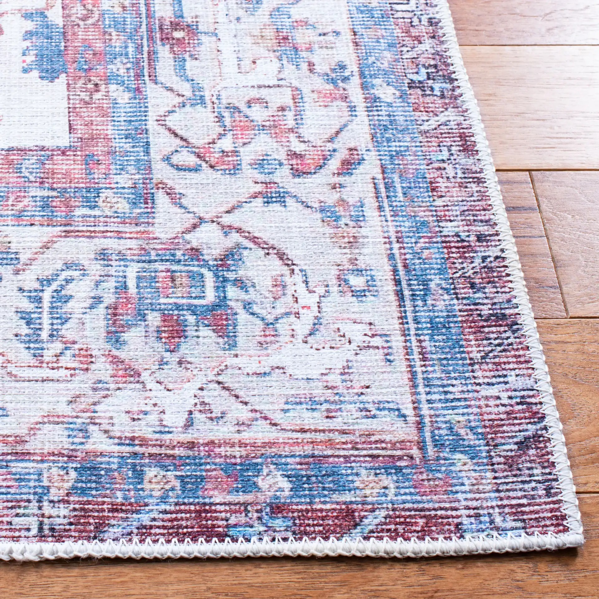 Serapi Panel Medallion Washable Rug in Red / Ivory in a styled room