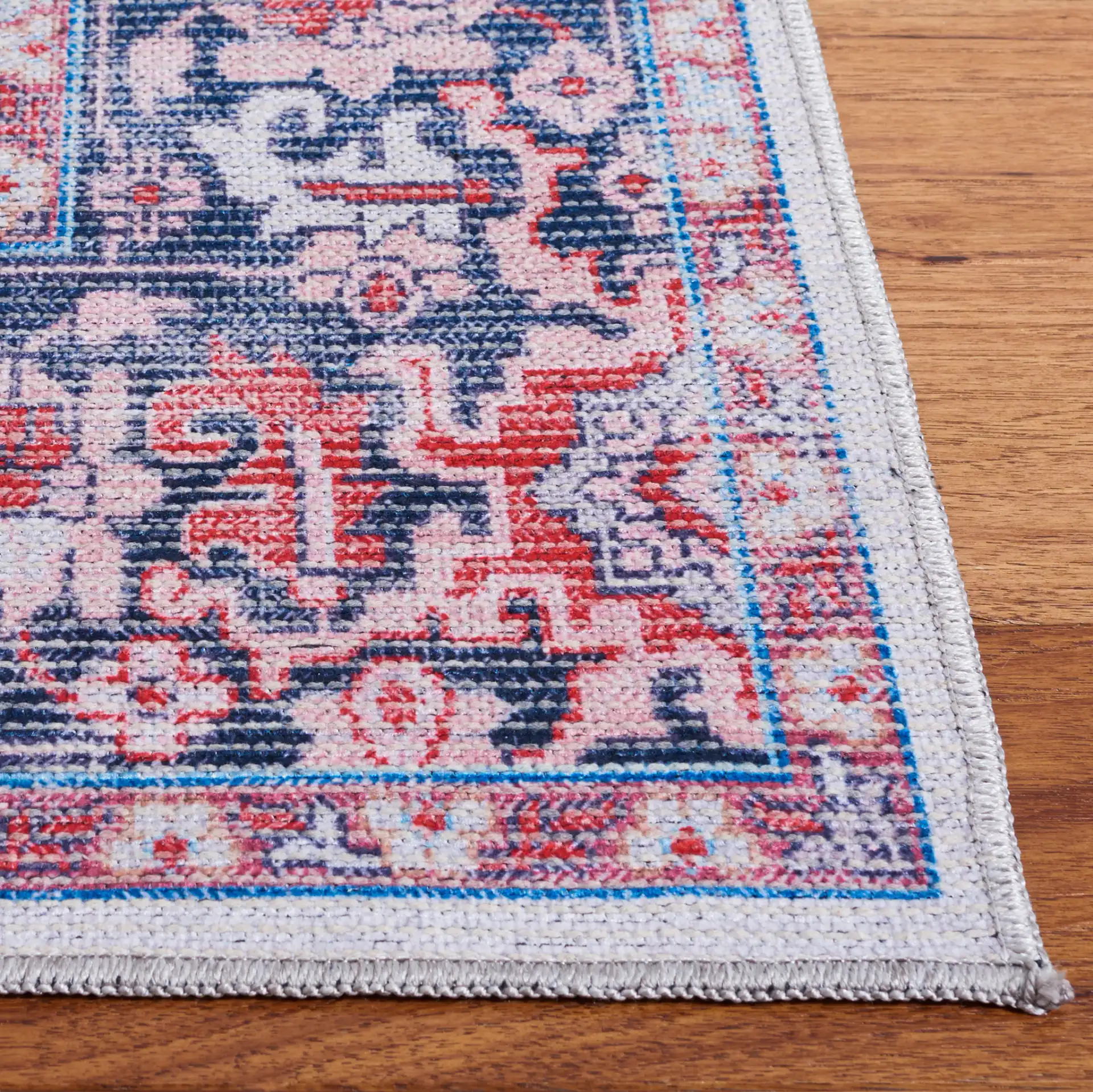 Serapi Star Medallion Washable Rug in Blue / Rust in a styled room