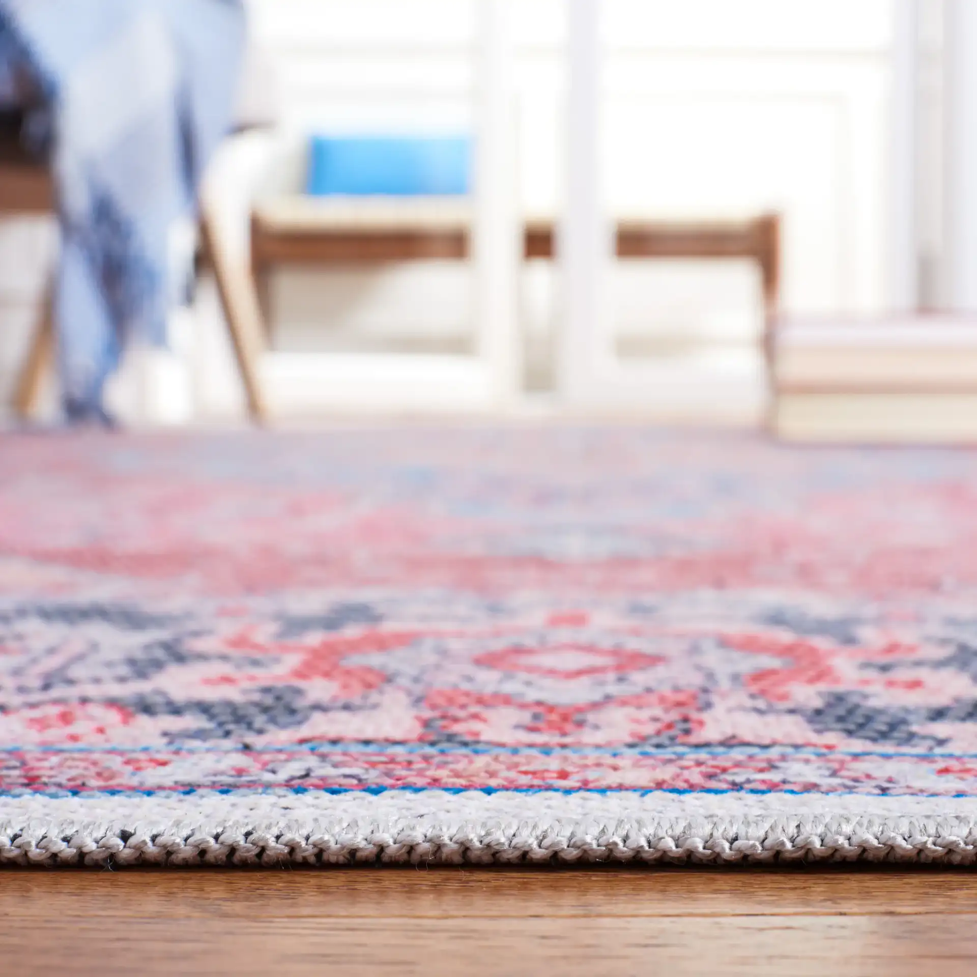 Serapi Star Medallion Washable Rug in Blue / Rust in a styled room