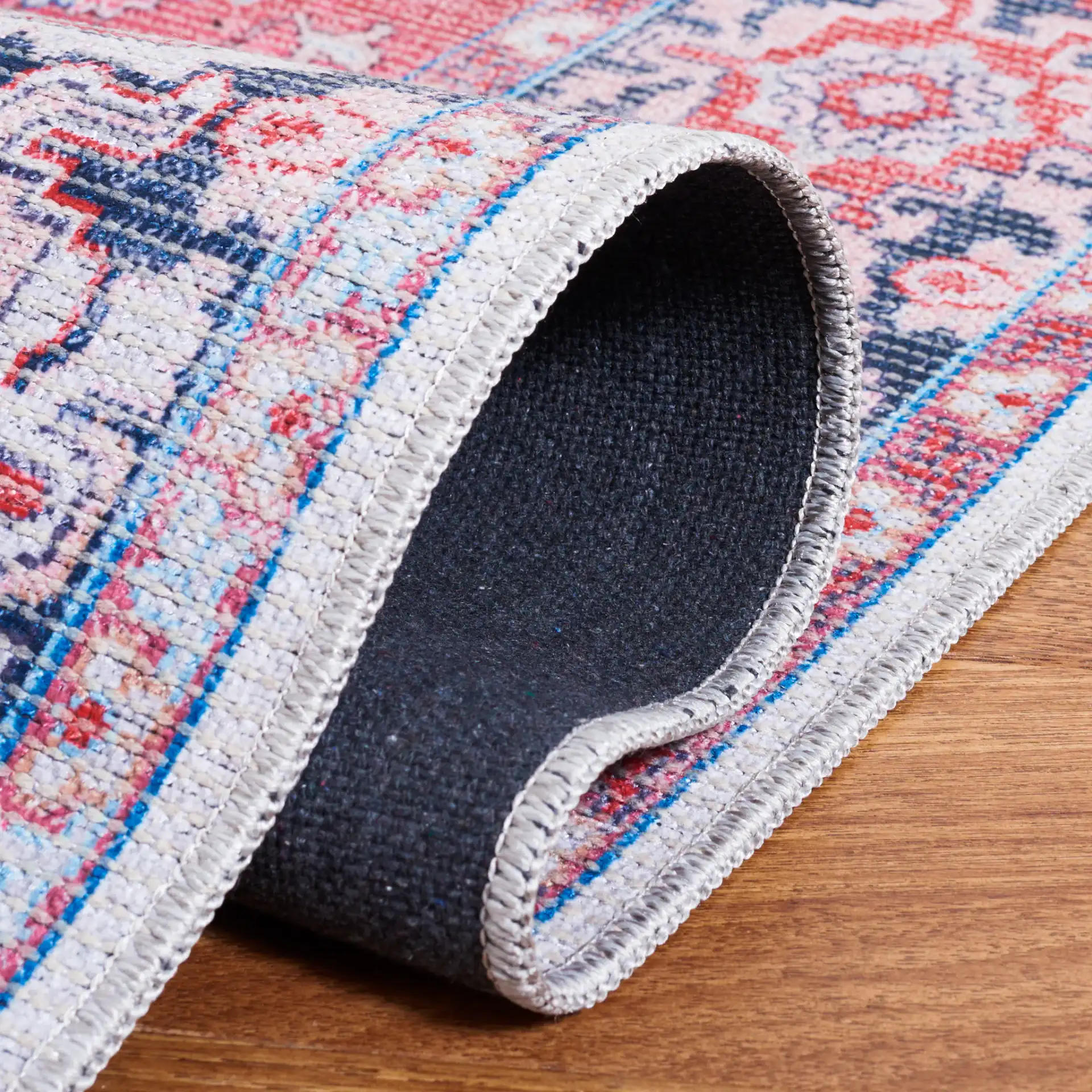 Serapi Star Medallion Washable Rug in Blue / Rust in a styled room