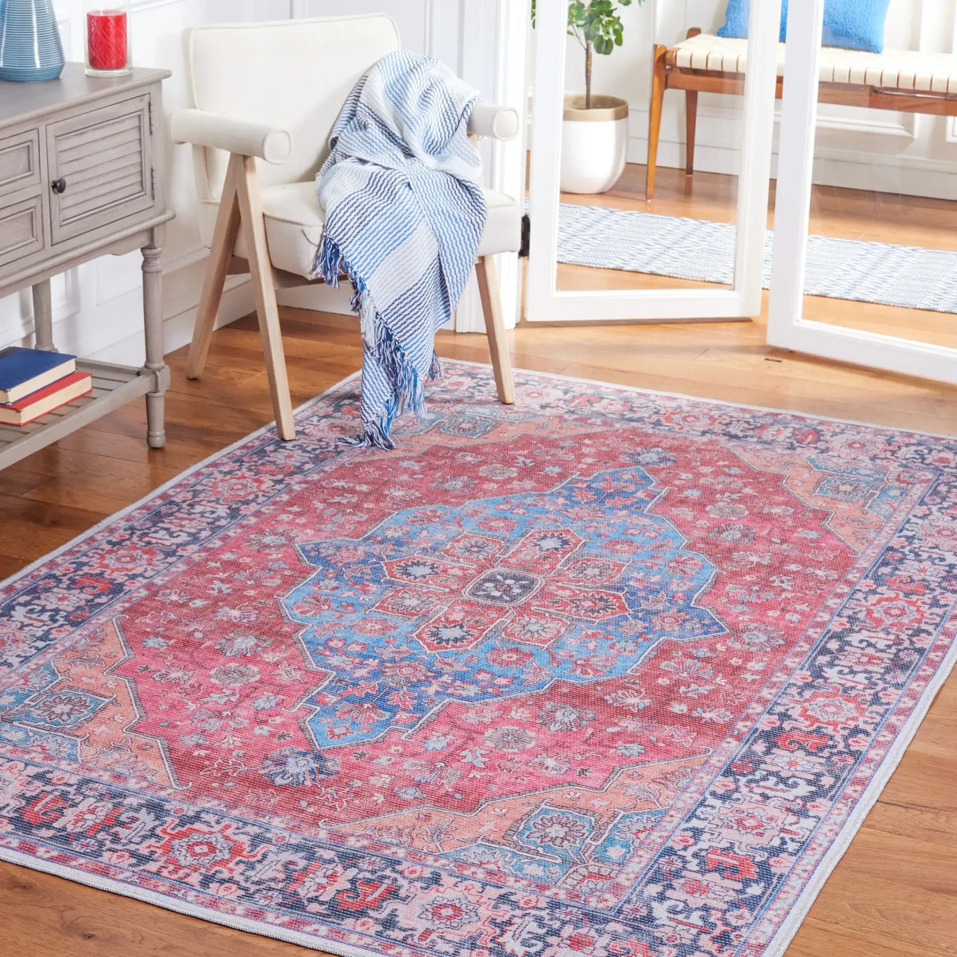 Serapi Star Medallion Washable Rug in Blue / Rust in a styled room