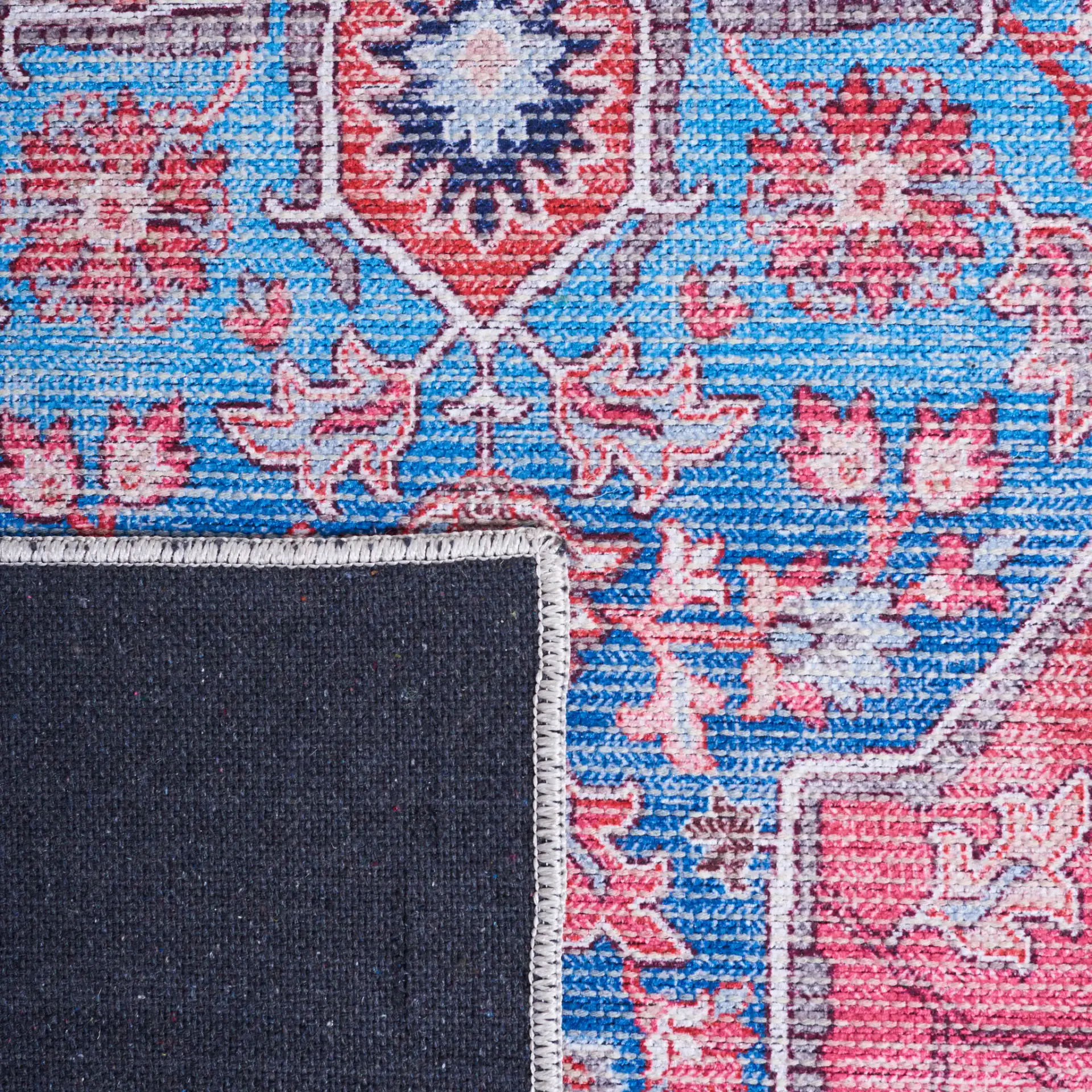 Serapi Star Medallion Washable Rug in Blue / Rust in a styled room