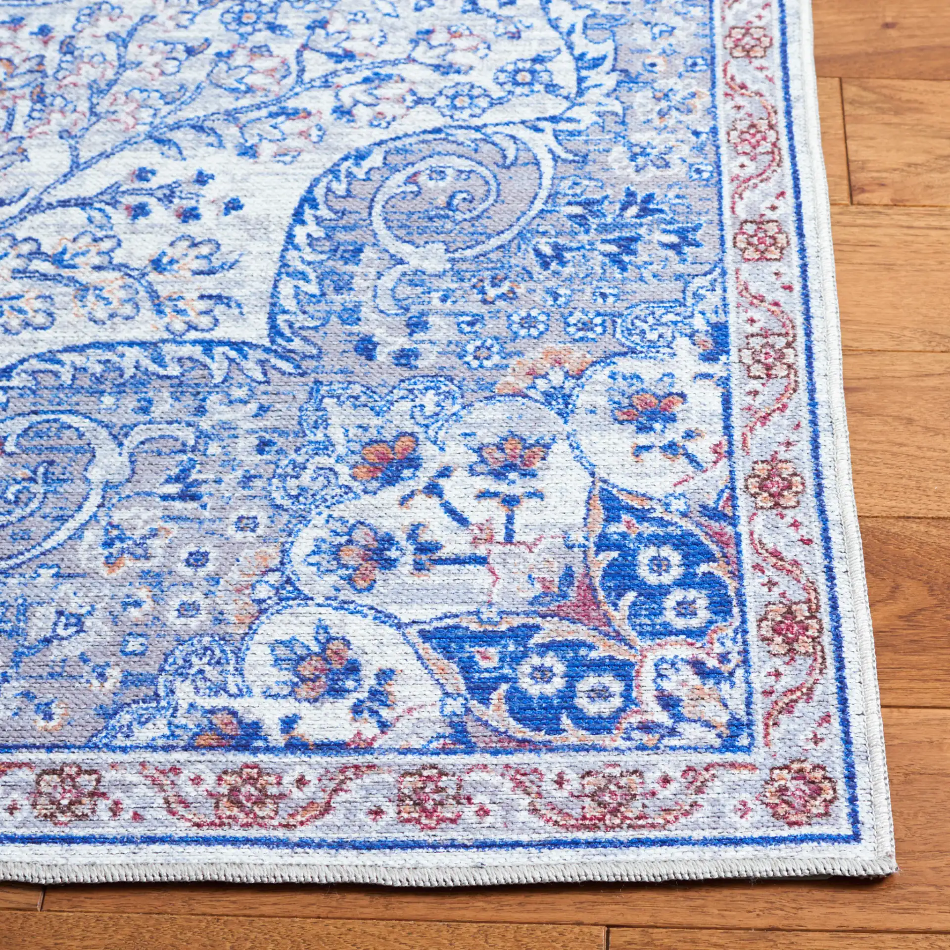 Serapi Arabesque Medallion Washable Rug in Ivory / Red in a styled room