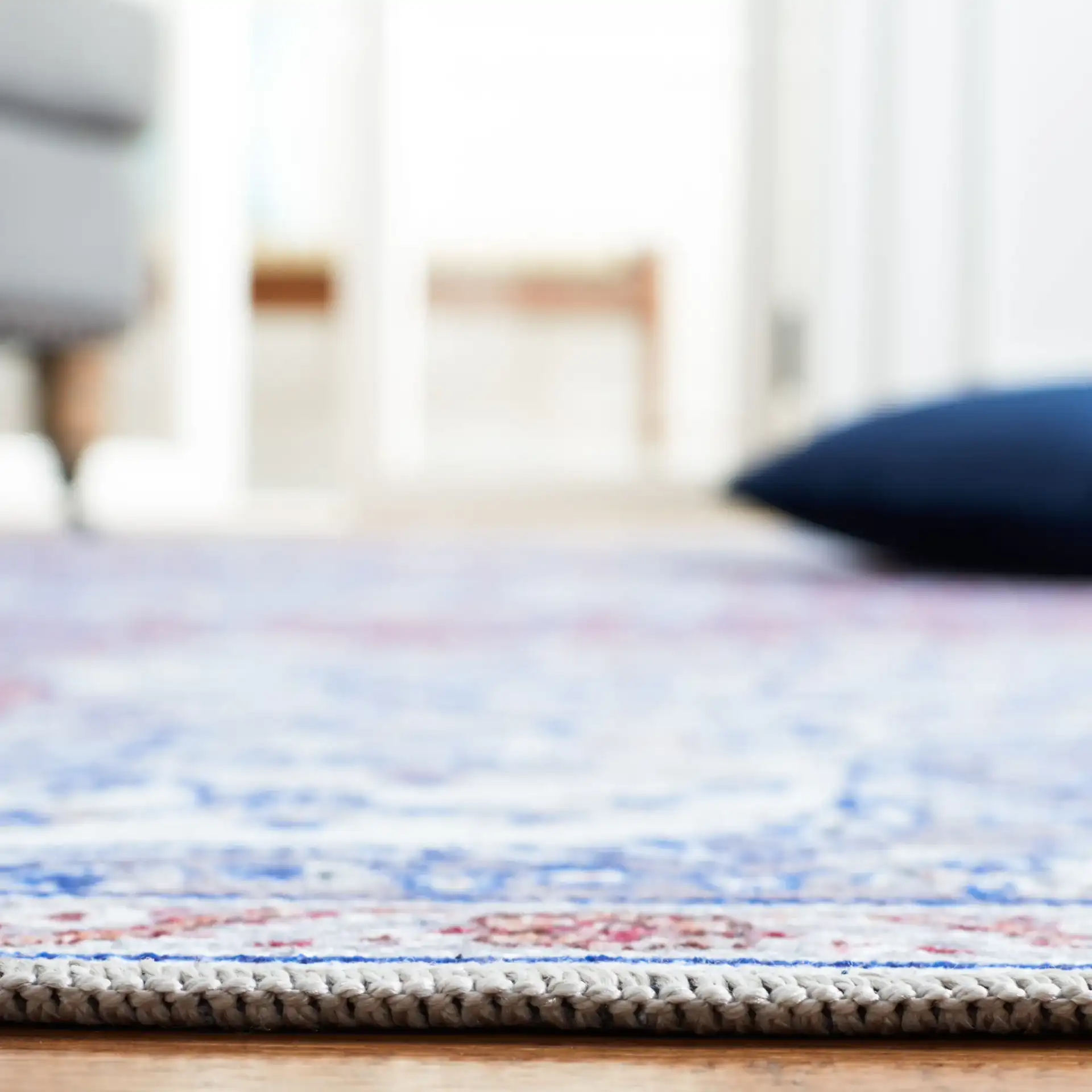 Serapi Arabesque Medallion Washable Rug in Ivory / Red in a styled room