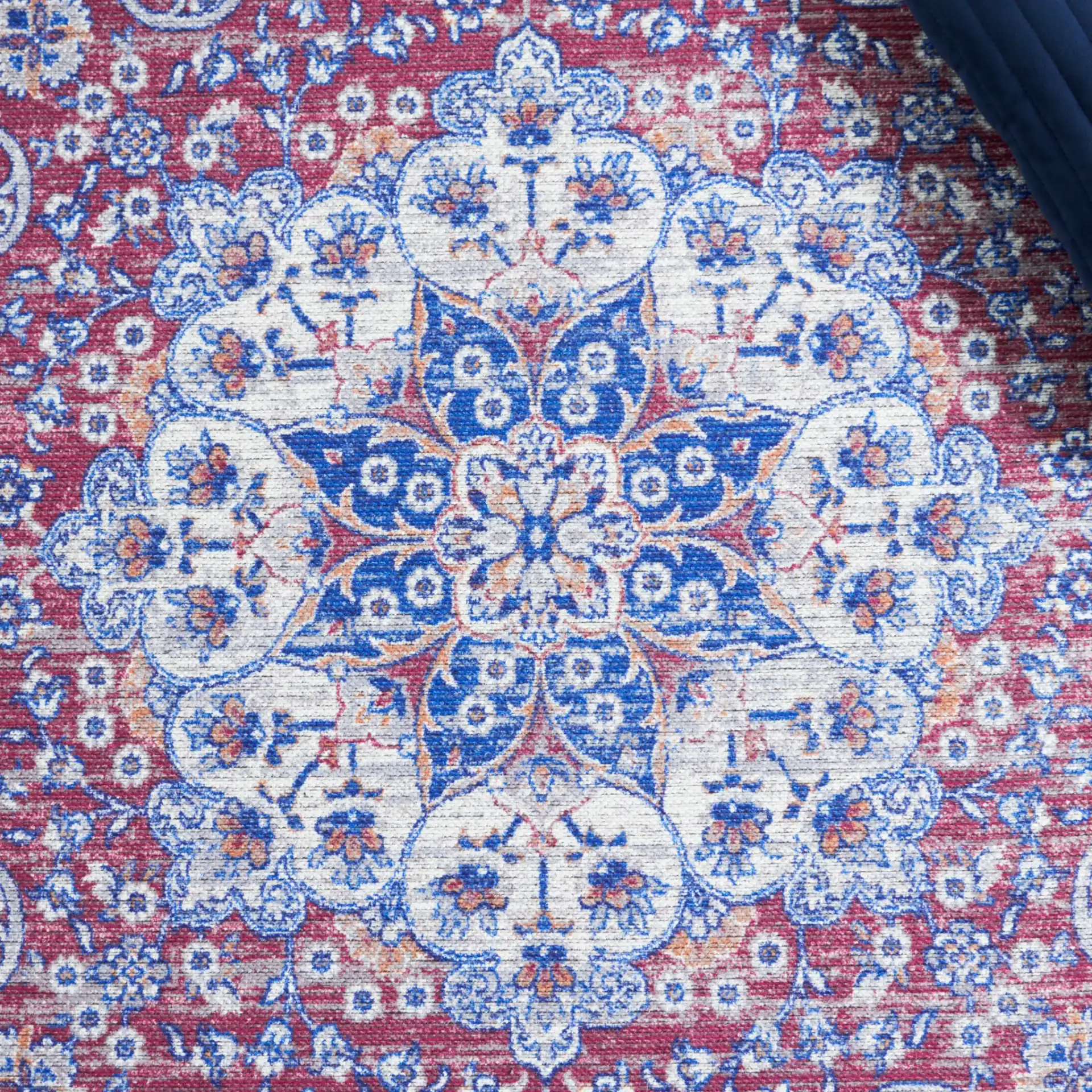 Serapi Arabesque Medallion Washable Rug in Ivory / Red in a styled room