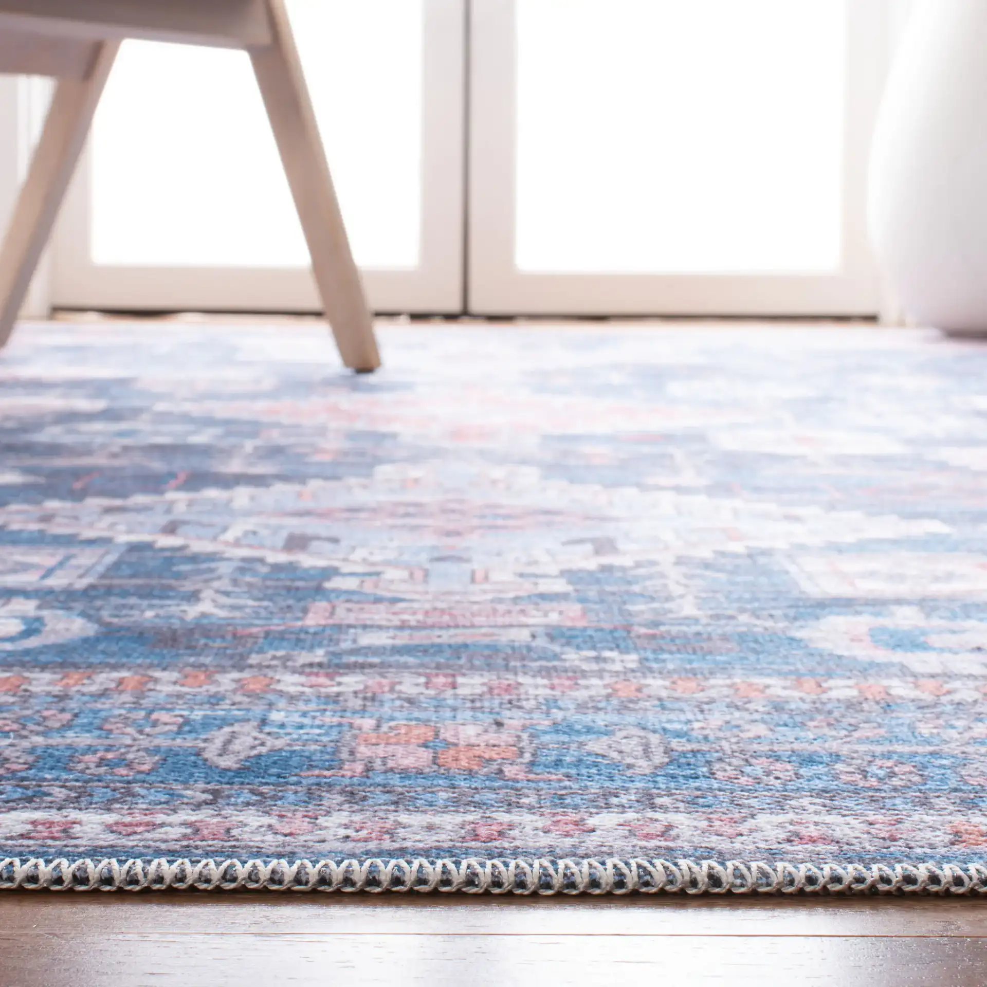 Serapi Diamond Medallion Washable Rug in Blue / Ivory in a styled room