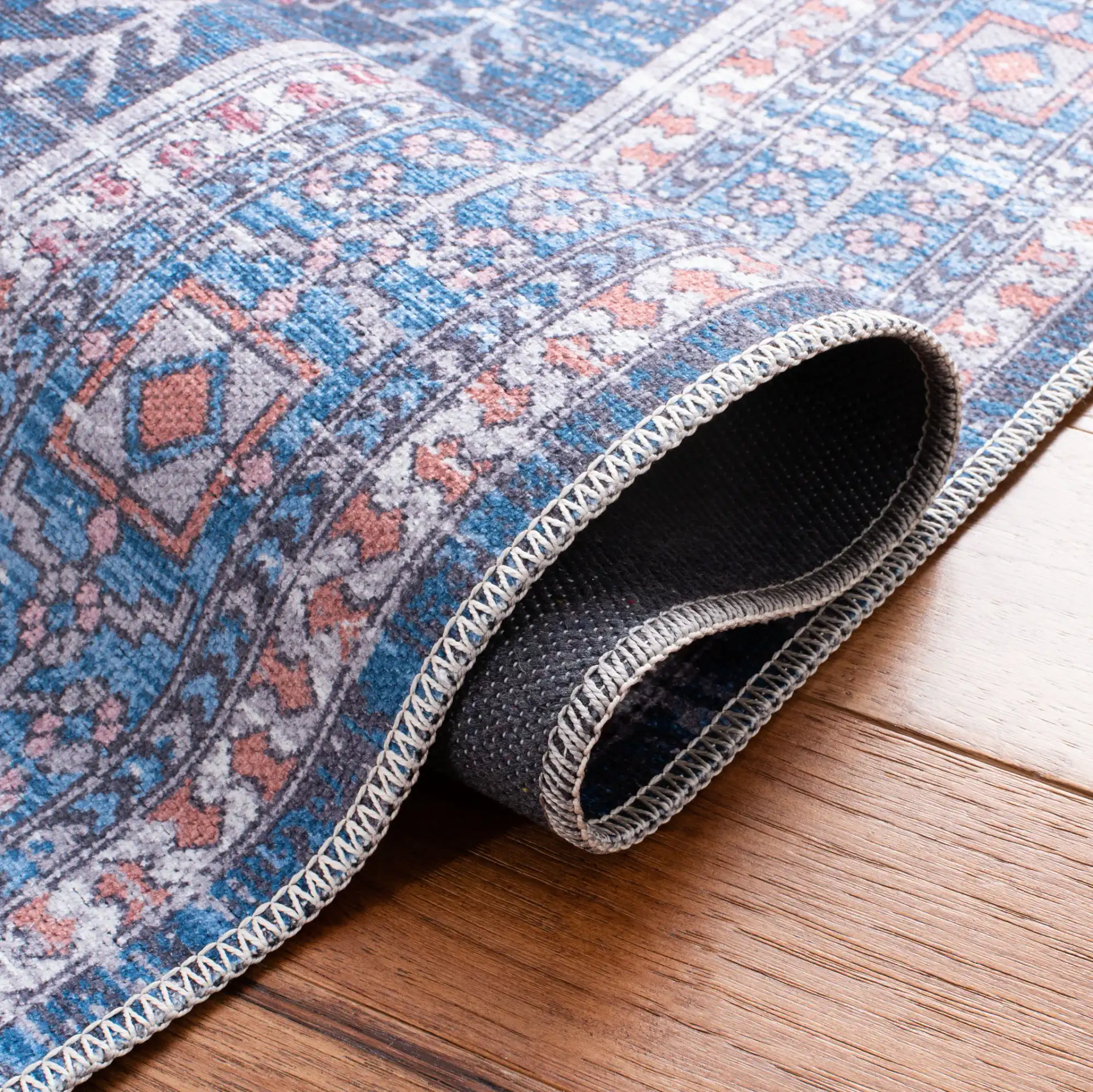 Serapi Diamond Medallion Washable Rug in Blue / Ivory in a styled room