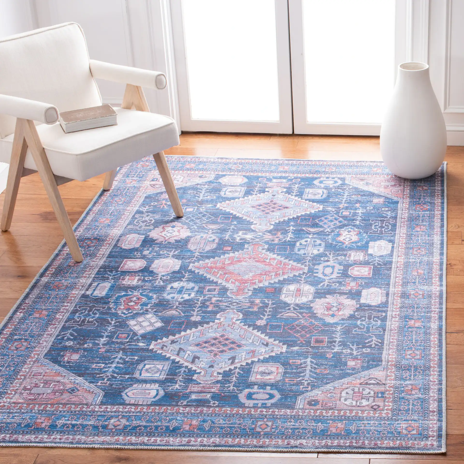 Serapi Diamond Medallion Washable Rug in Blue / Ivory in a styled room