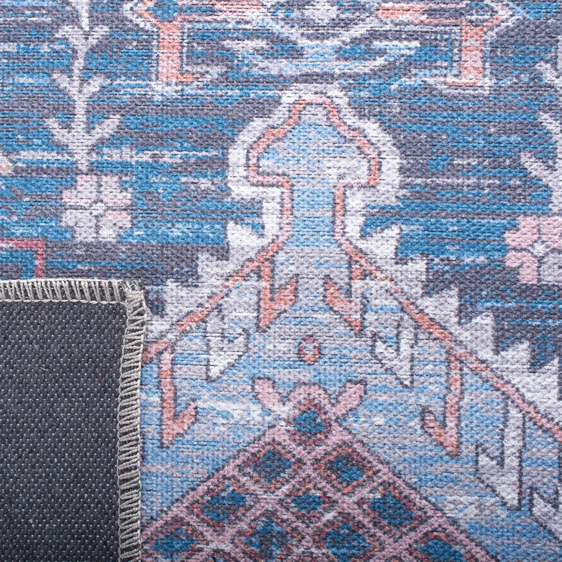 Serapi Diamond Medallion Washable Rug in Blue / Ivory in a styled room