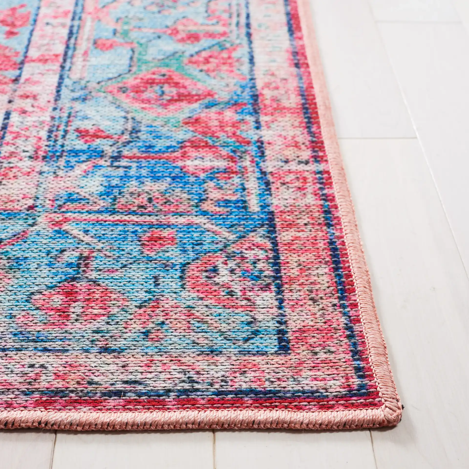 Serapi Central Medallion Washable Rug in Light Blue / Red in a styled room