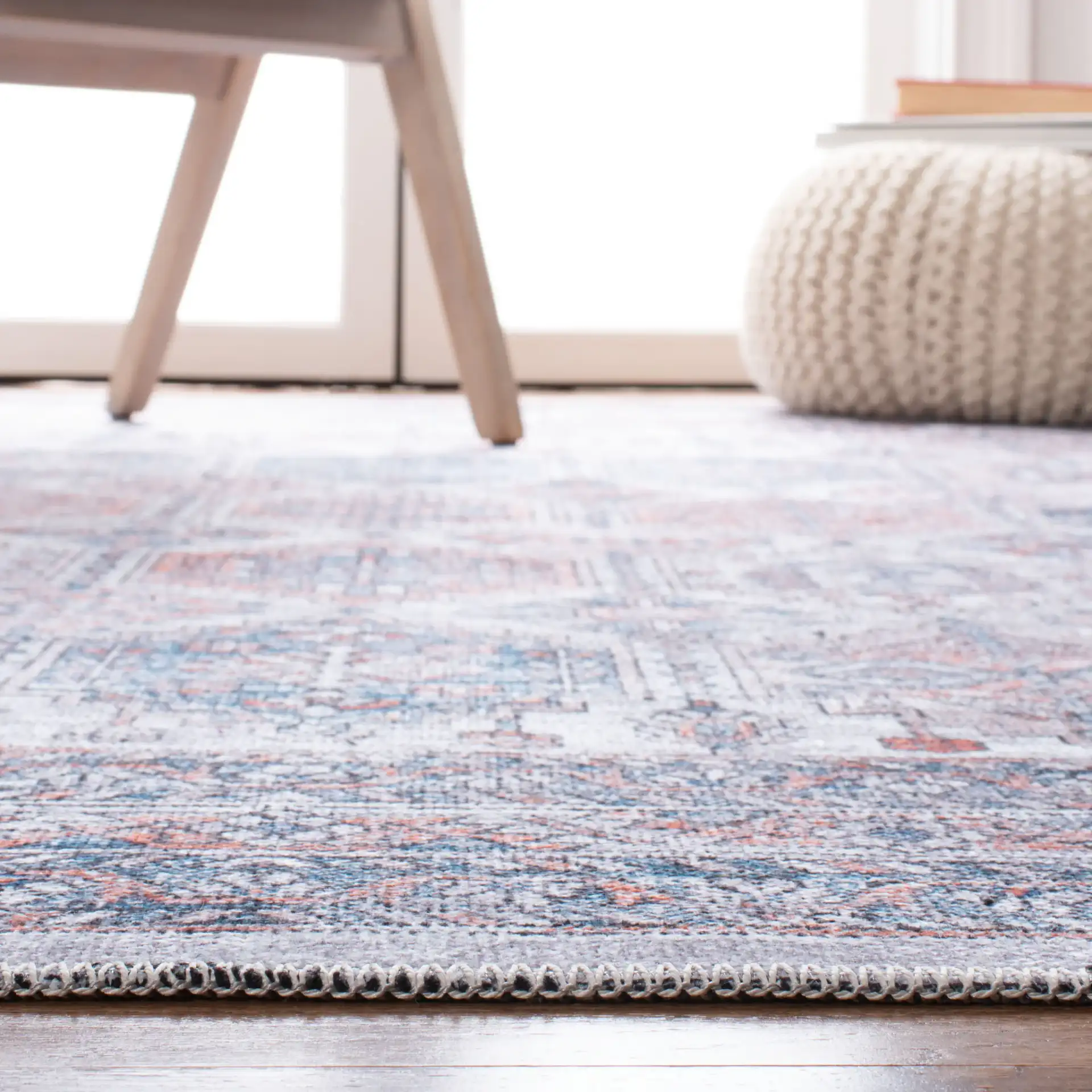 Serapi Geometric Grid Washable Rug in Ivory / Rust in a styled room