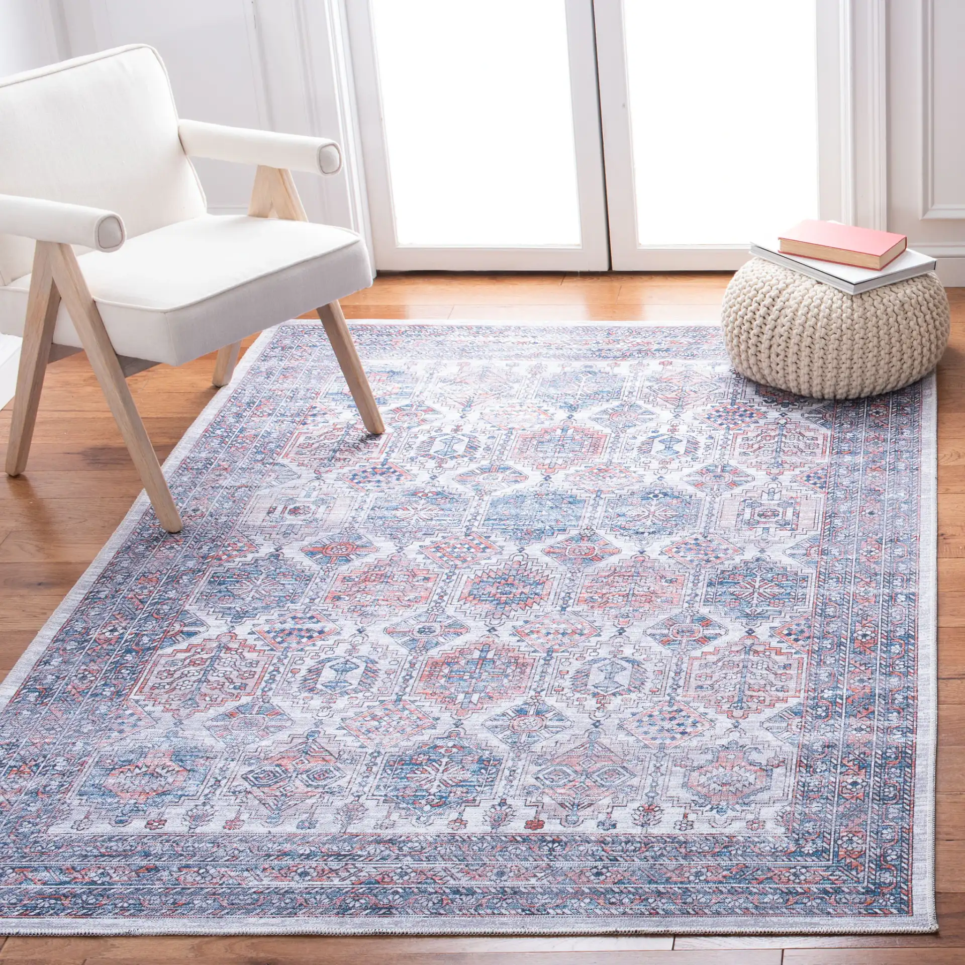 Serapi Geometric Grid Washable Rug in Ivory / Rust in a styled room