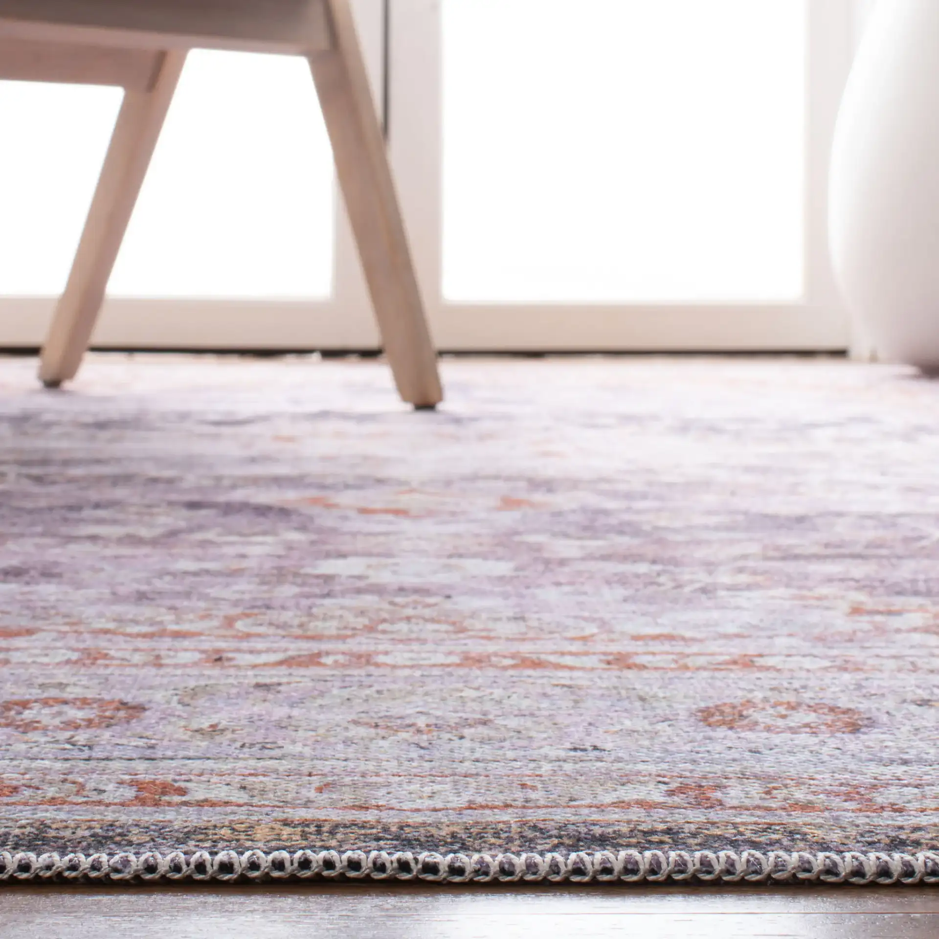 Serapi Distressed Medallion Washable Rug in Gray / Light Gray in a styled room