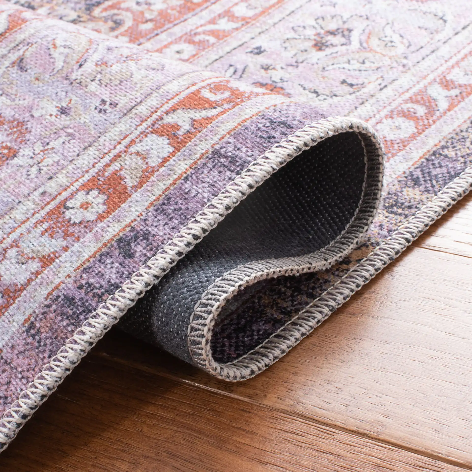 Serapi Distressed Medallion Washable Rug in Gray / Light Gray in a styled room